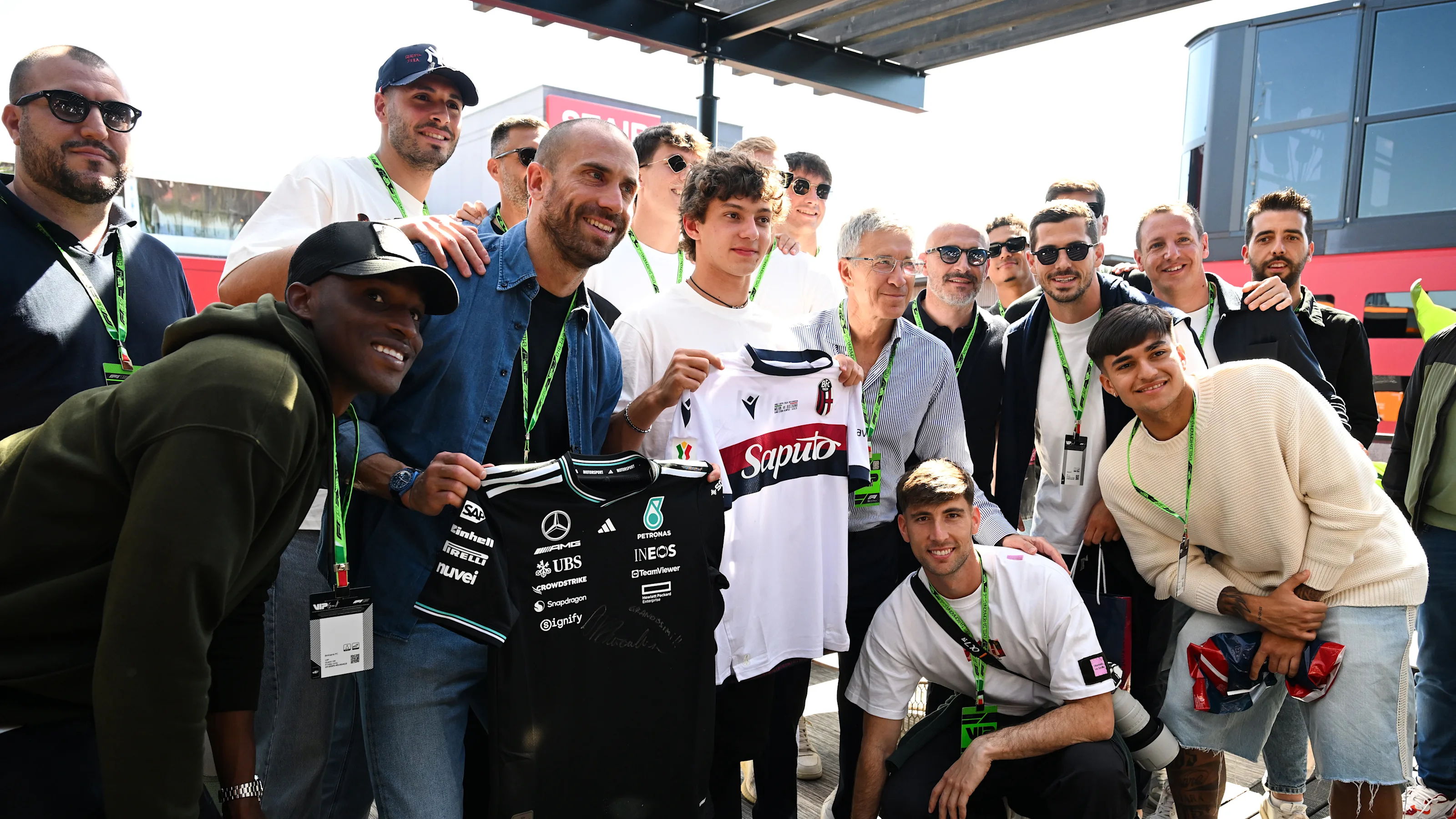IMOLA, ITALY - MAY 16: Lorenzo De Silvestri of FC Bologna swaps shirts with Andrea Kimi Antonelli