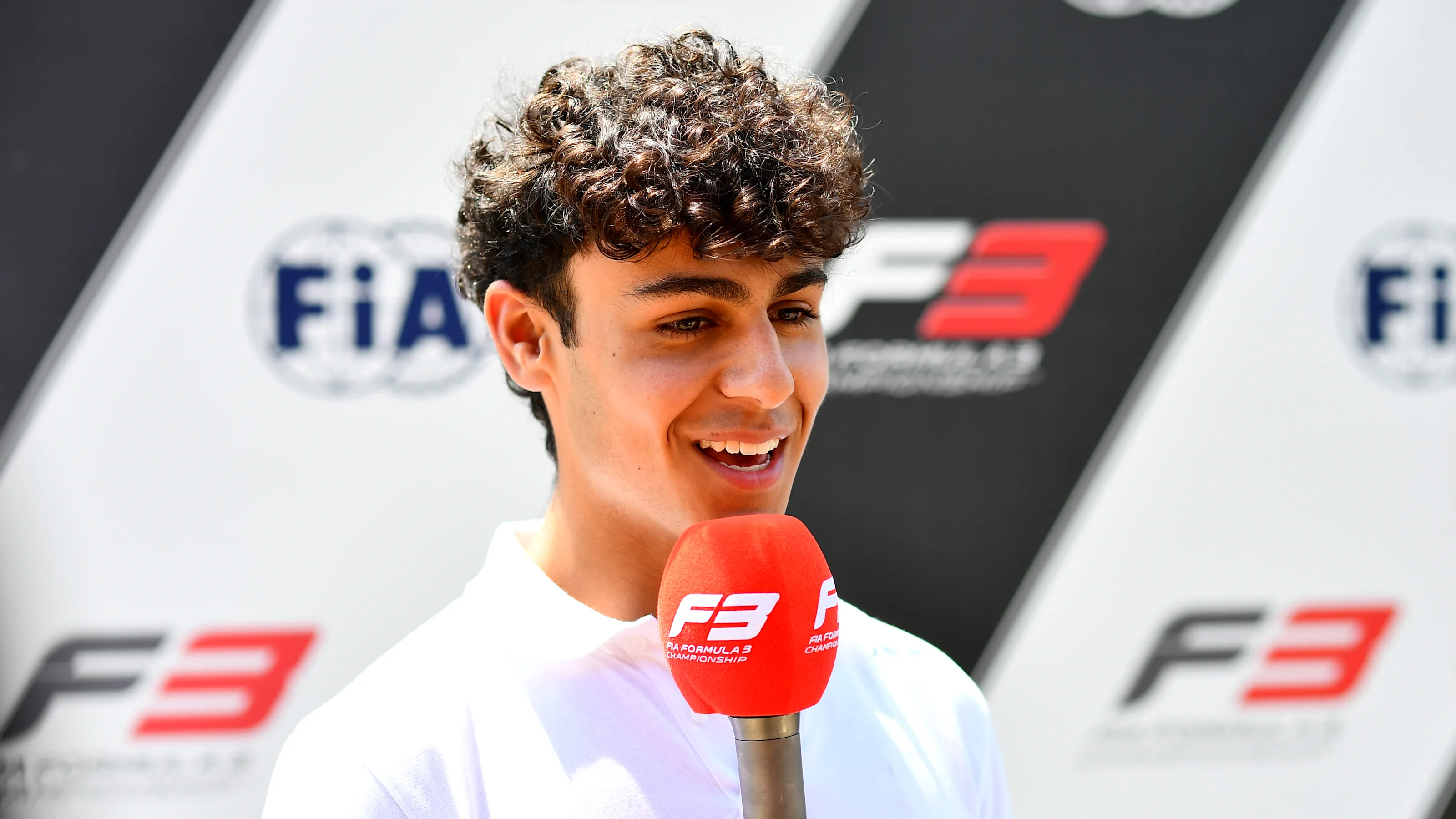 BUDAPEST, HUNGARY - JULY 18: Arvid Lindblad of Great Britain and PREMA Racing (3) talks to the