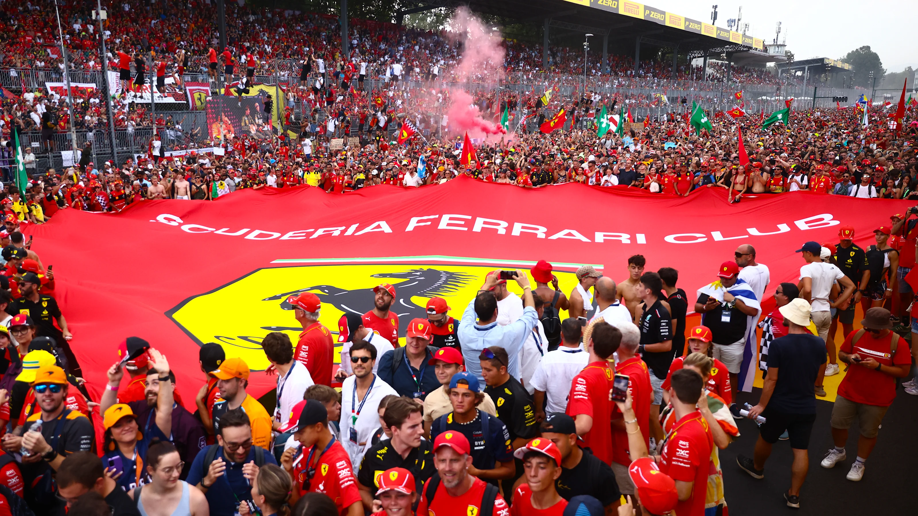 Tifosi celebrate after Charles Leclerc of Ferrari wins the Italian Formula One Grand Prix at