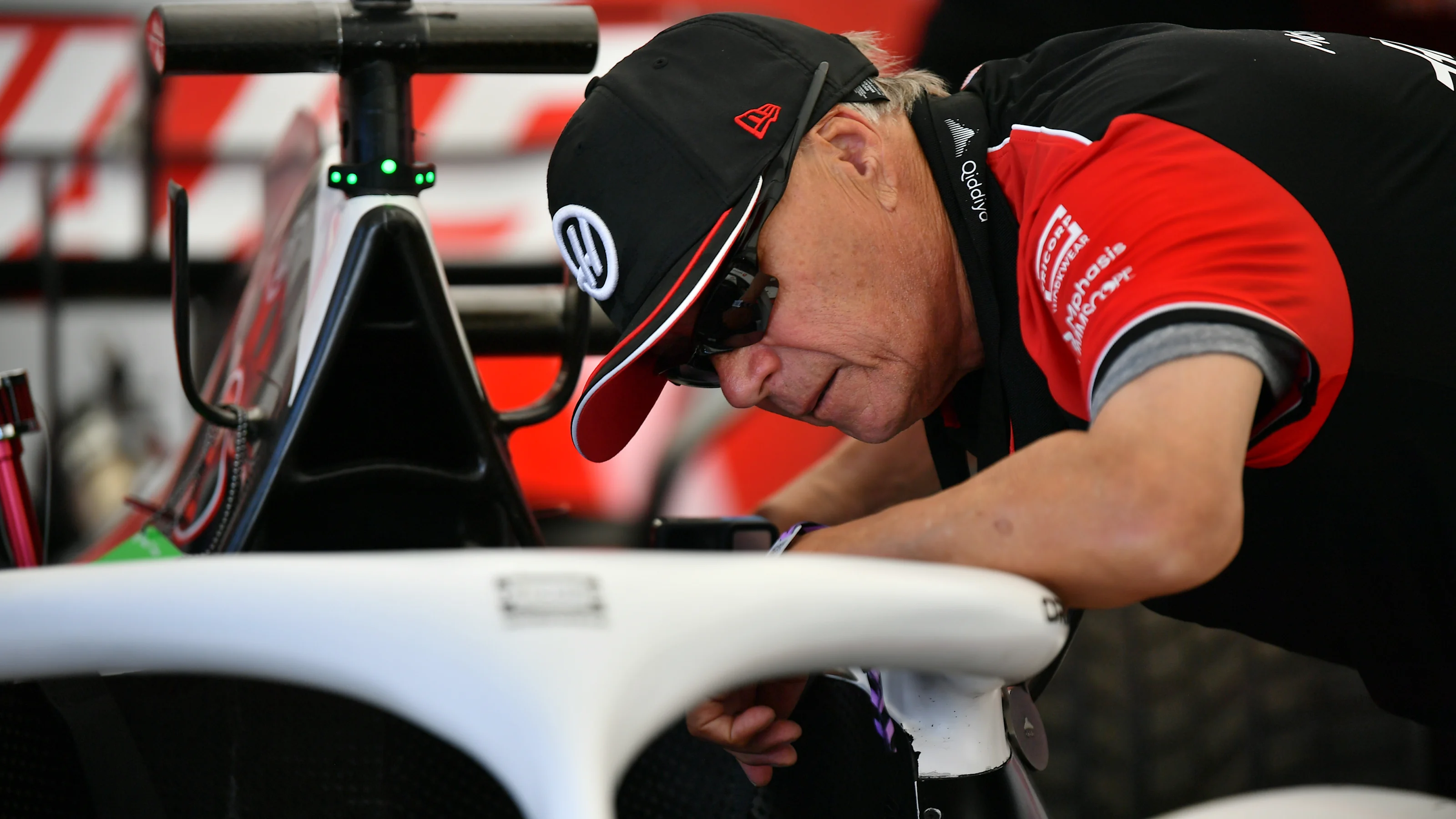CHICHESTER, ENGLAND - JULY 11: Gene Haas, Founder and Chairman of Haas F1 inspects the car during