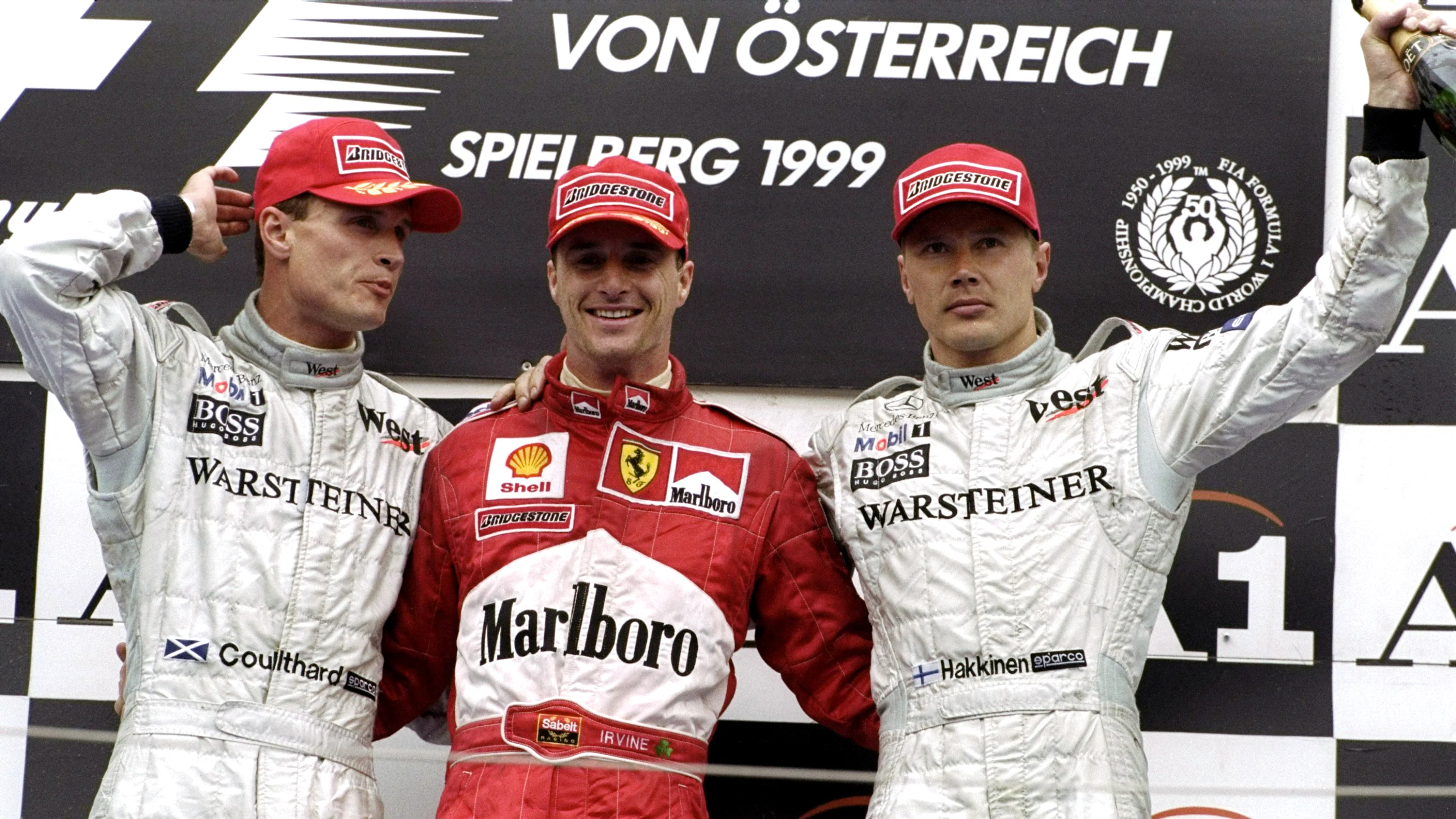 25 Jul 1999: Ferrari's Eddie Irvine (first), David Coulthard (2nd) and Mika Hakkinen (3rd) of