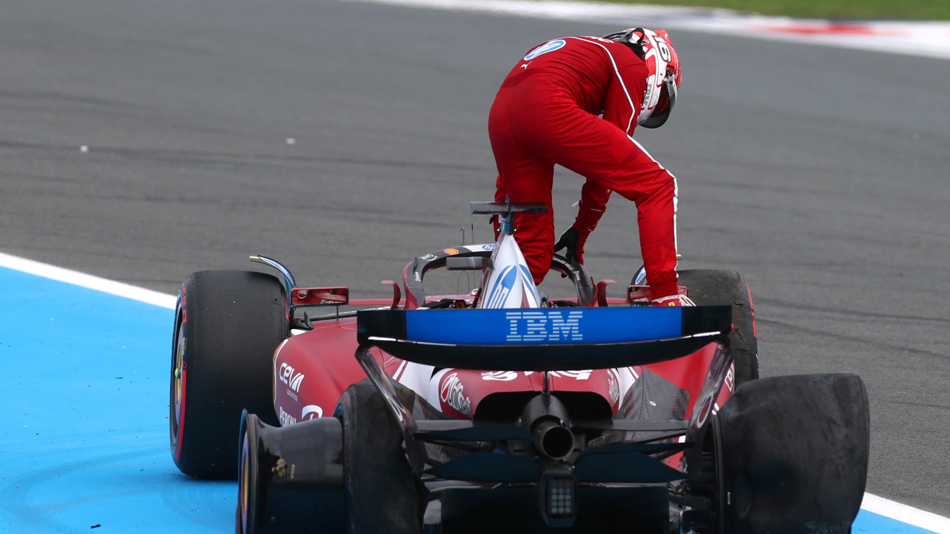 ZANDVOORT, NETHERLANDS - AUGUST 31: Charles Leclerc of Monaco and Scuderia Ferrari climbs out of