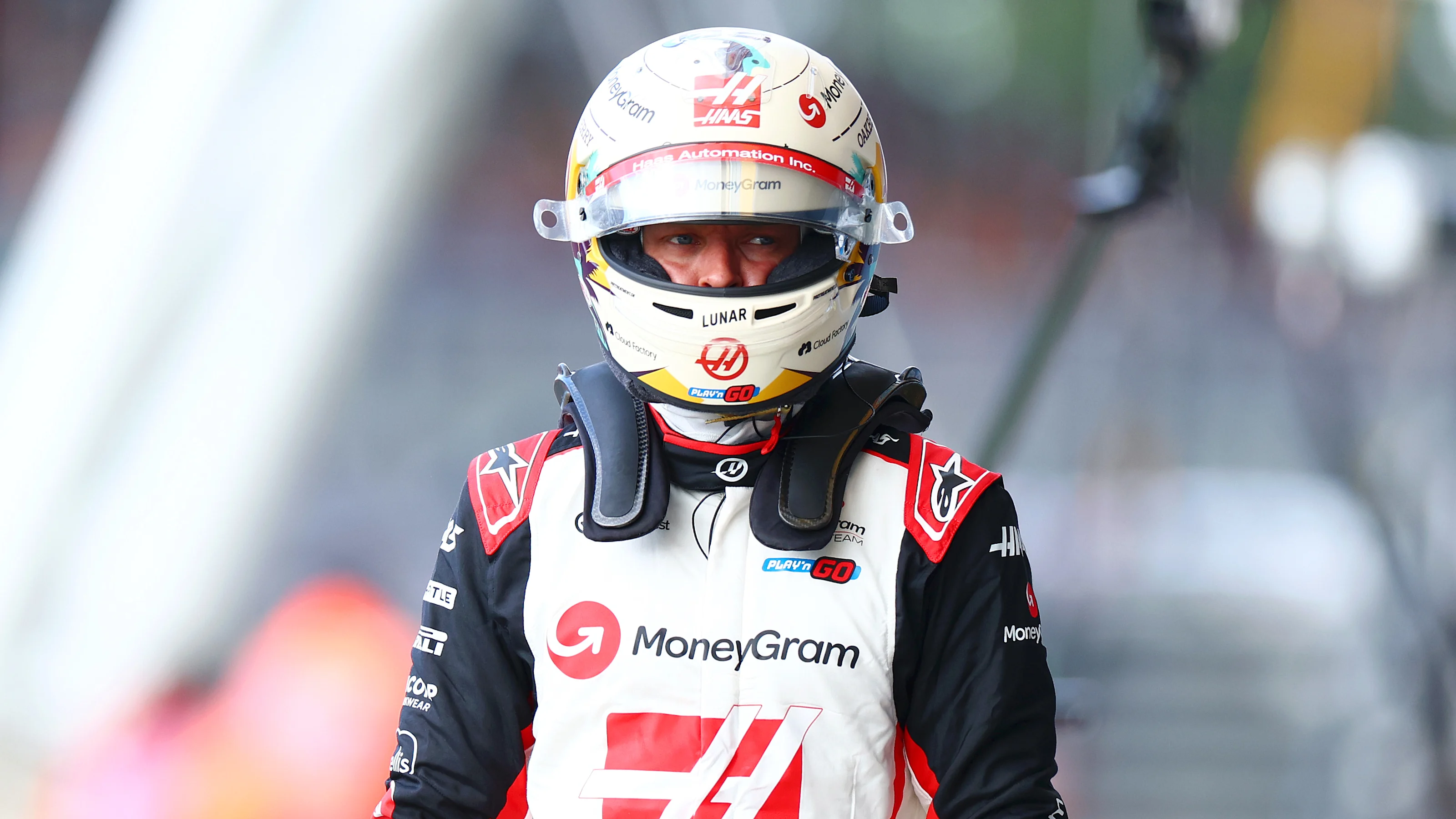 NORTHAMPTON, ENGLAND - JULY 06: 17th placed qualifier Kevin Magnussen of Denmark and Haas F1 walks