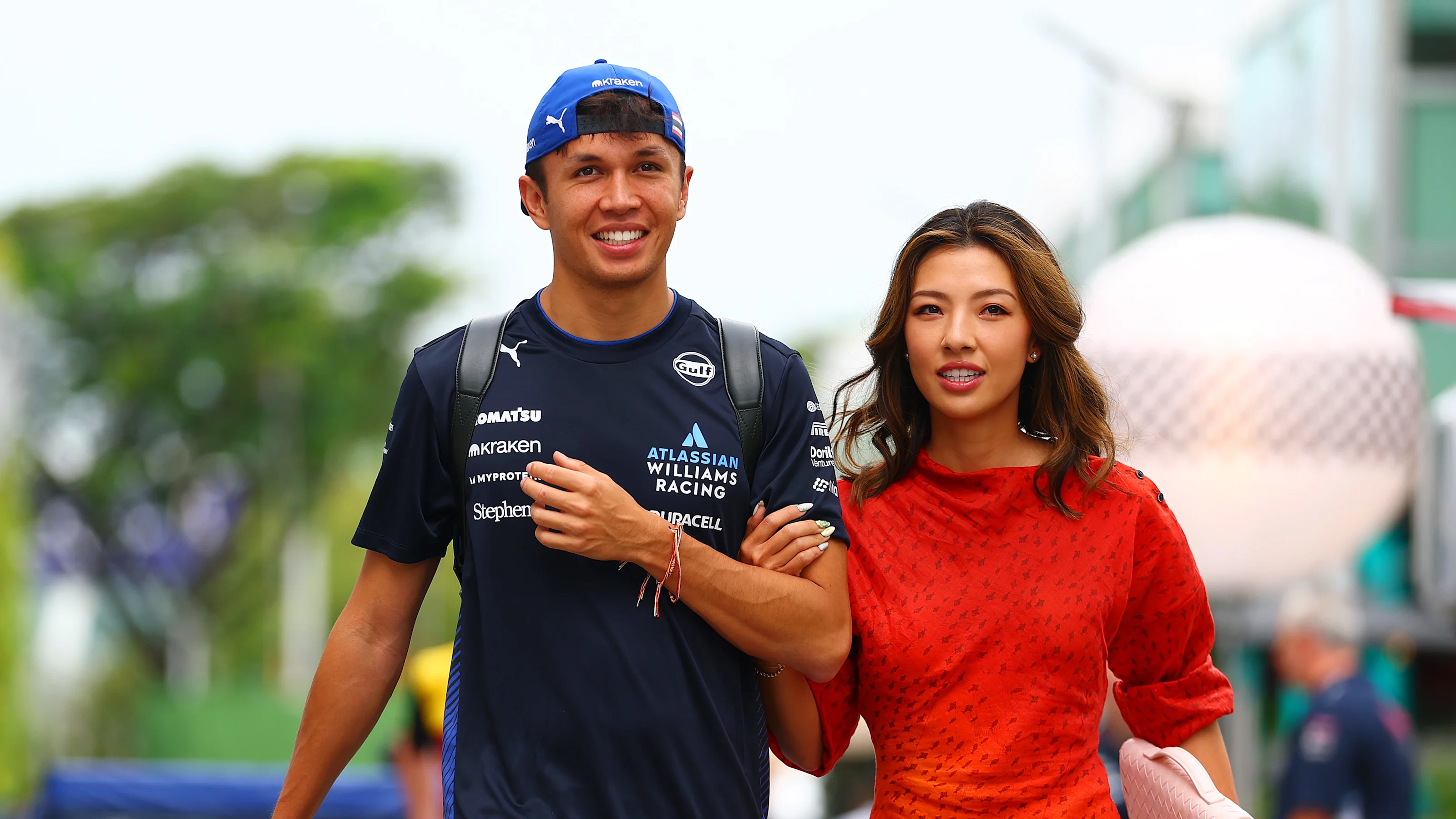 SINGAPORE, SINGAPORE - OCTOBER 03: Alexander Albon of Thailand and Williams and Lily Muni He arrive
