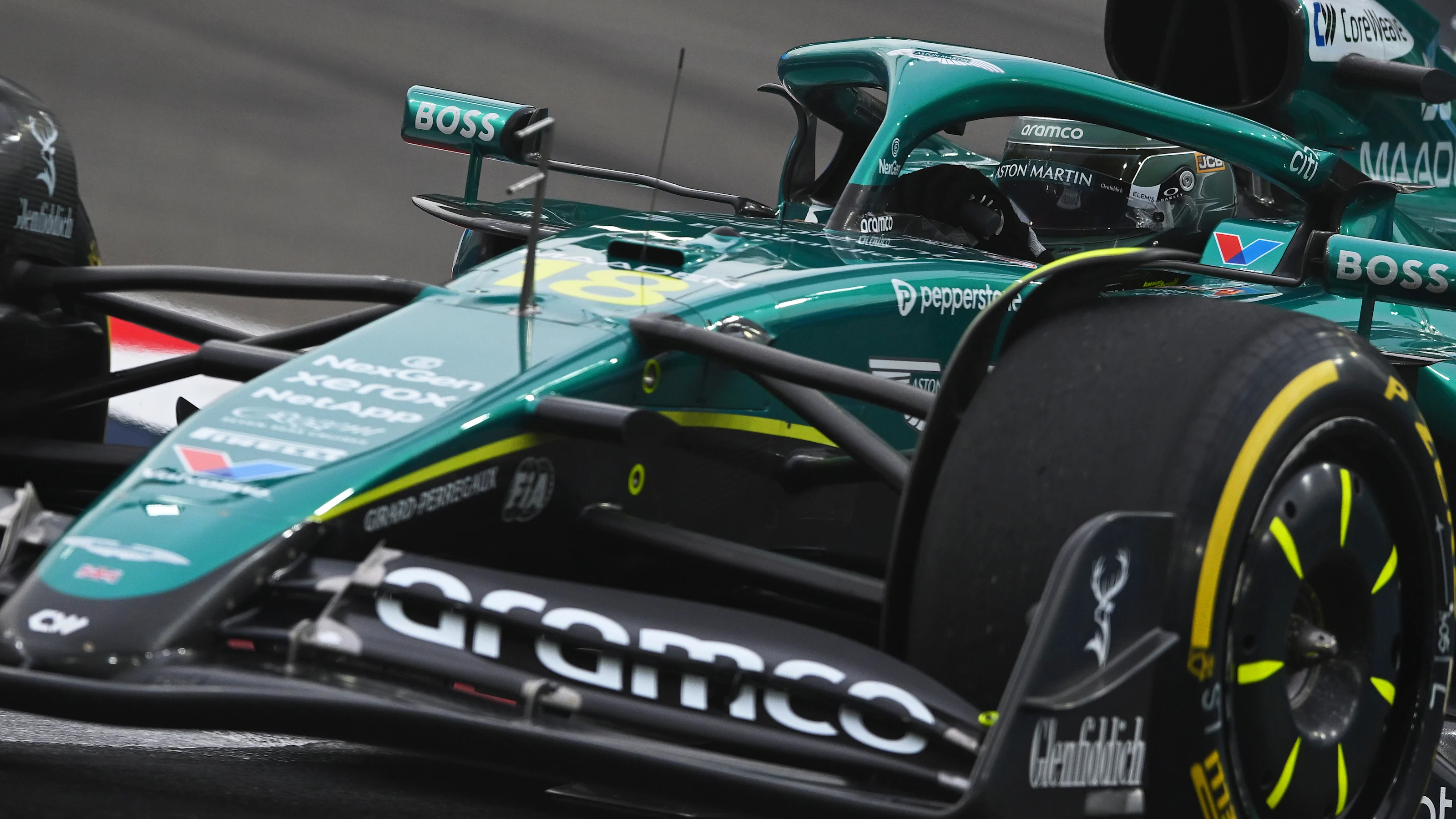 SINGAPORE, SINGAPORE - OCTOBER 04: Lance Stroll of Canada driving the (18) Aston Martin F1 Team