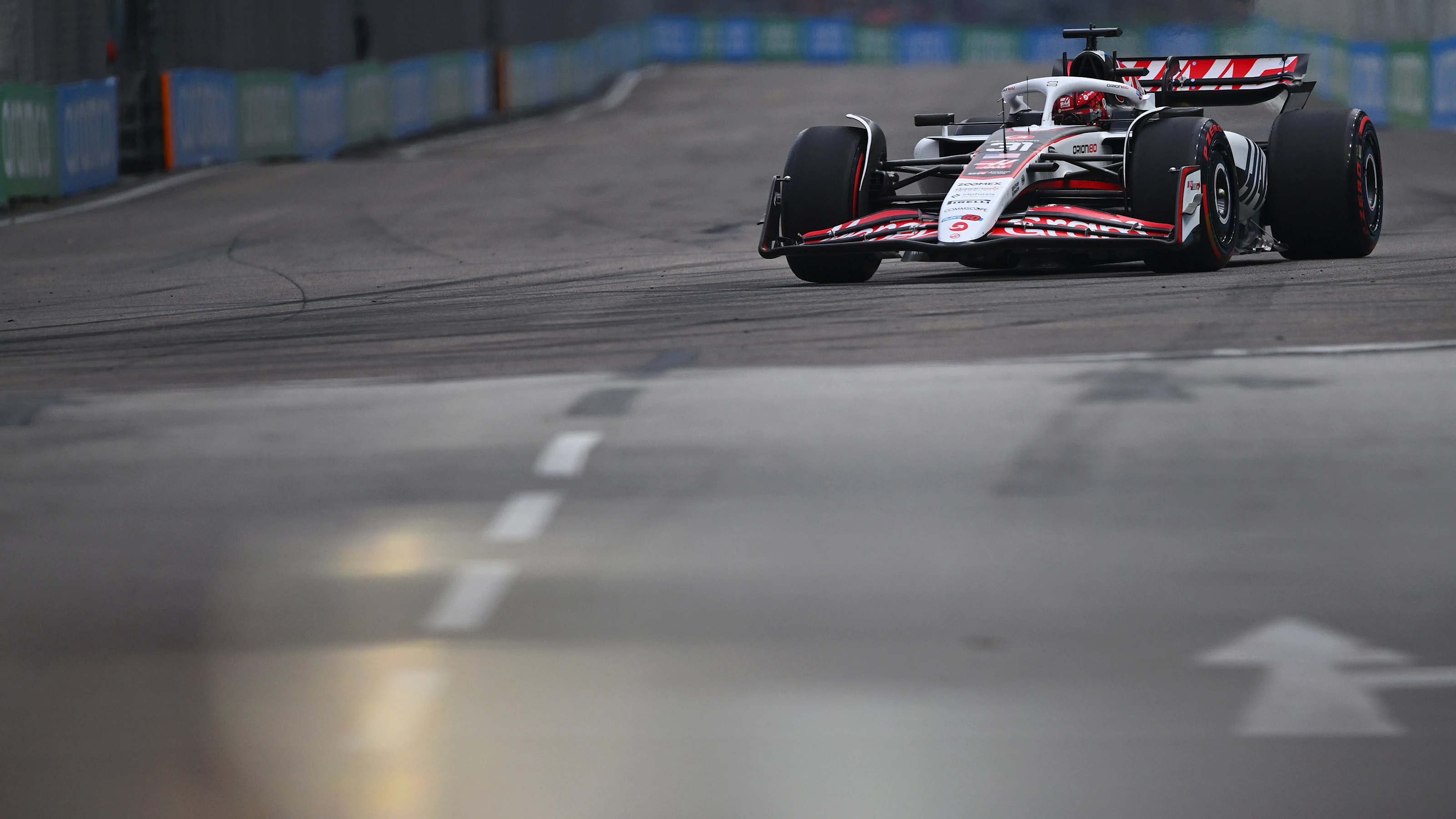 SINGAPORE, SINGAPORE - OCTOBER 04: Esteban Ocon of France driving the (31) Haas F1 VF-25 Ferrari on