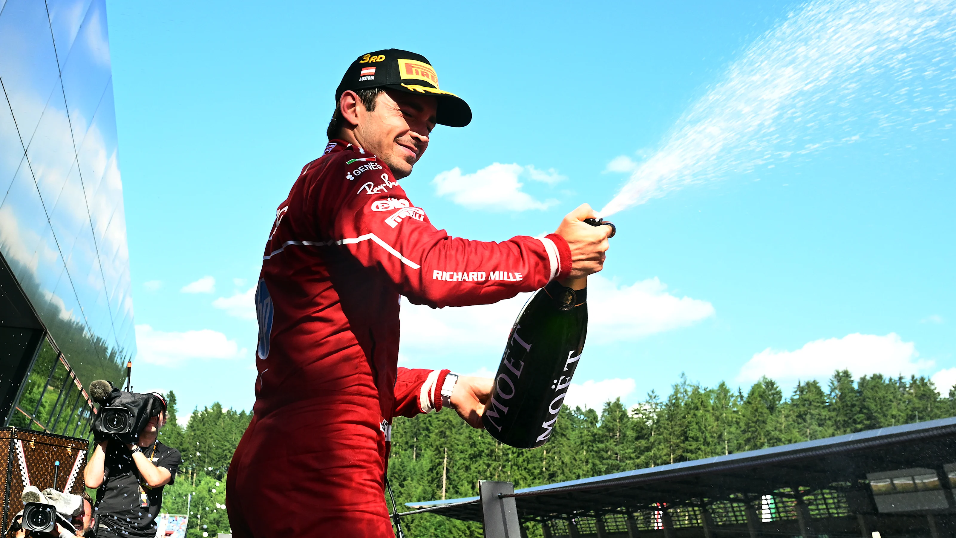 SPIELBERG, AUSTRIA - JUNE 29: Third placed Charles Leclerc of Monaco and Scuderia Ferrari sprays