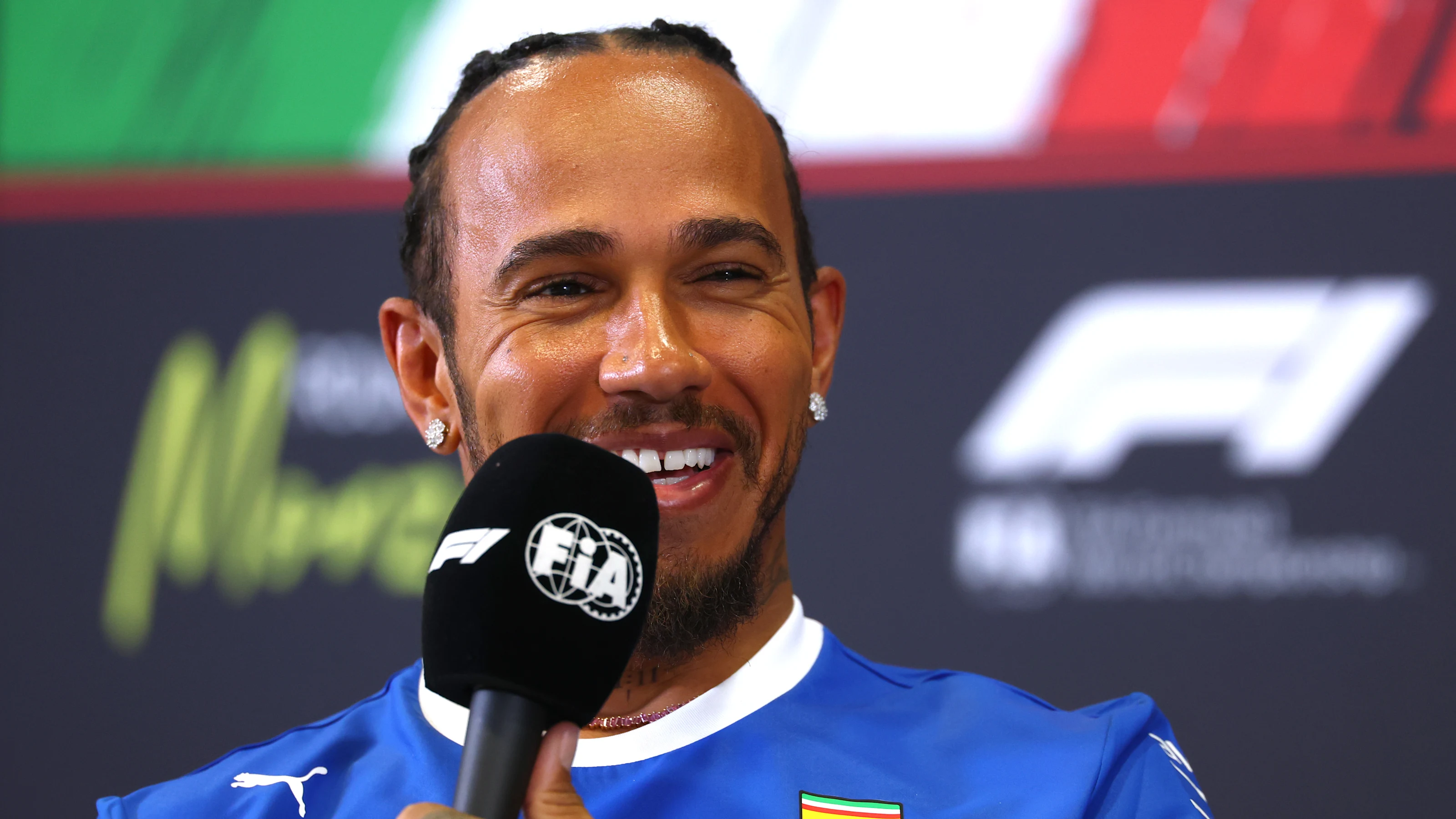 MONZA, ITALY - SEPTEMBER 04: Lewis Hamilton of Great Britain and Scuderia Ferrari speaks in the