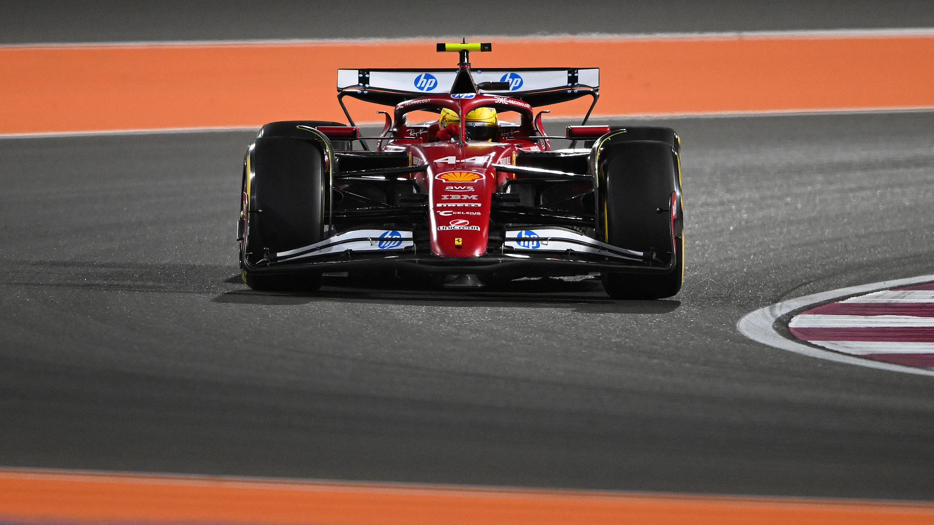 LUSAIL CITY, QATAR - NOVEMBER 29: Lewis Hamilton of Great Britain driving the (44) Scuderia Ferrari