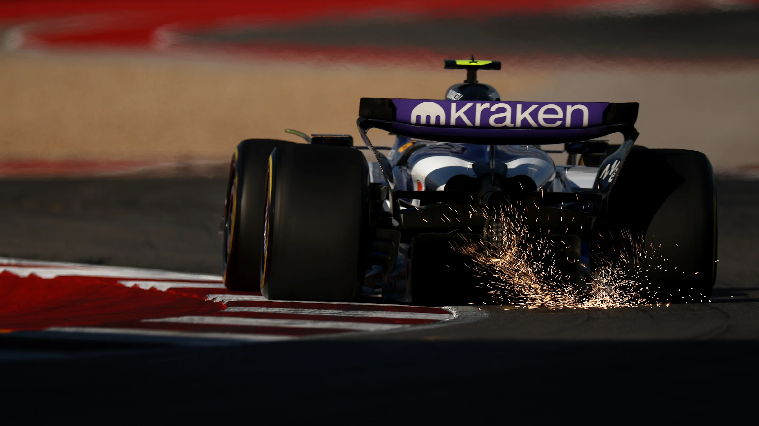 AUSTIN, TEXAS - OCTOBER 17: Sparks fly behind Carlos Sainz of Spain driving the (55) Williams FW47