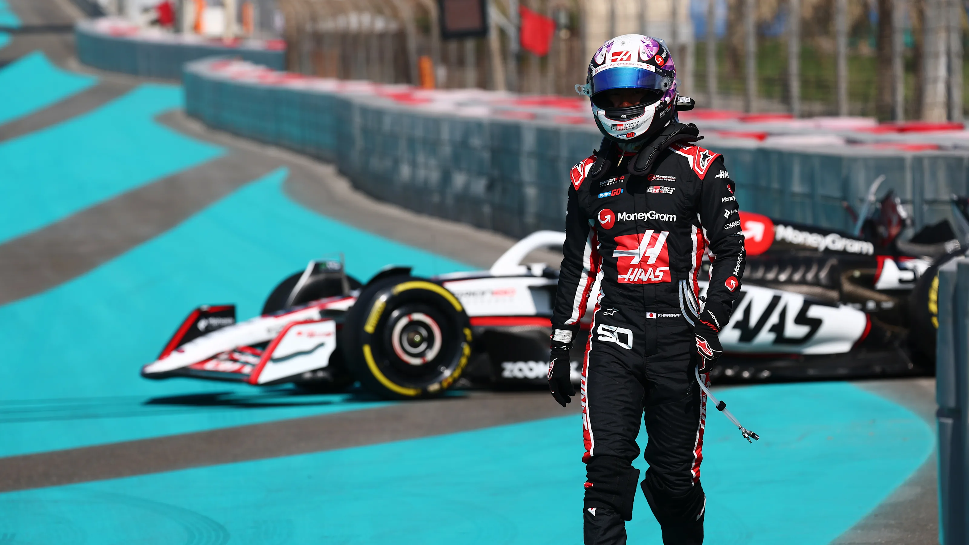 ABU DHABI, UNITED ARAB EMIRATES - DECEMBER 09: Ryo Hirakawa of Japan and Haas F1 walks from his car