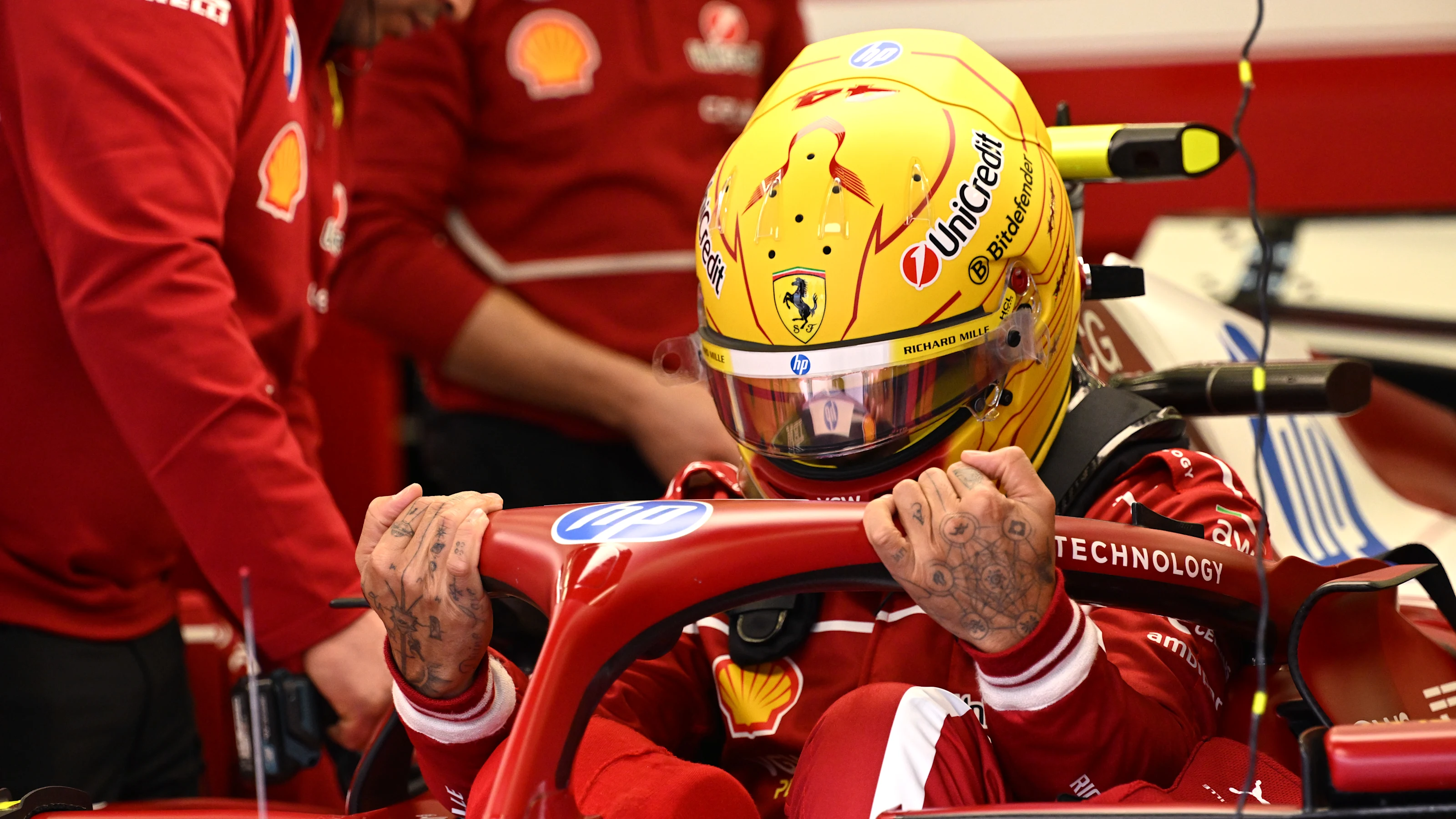 BAHRAIN, BAHRAIN - FEBRUARY 27: Lewis Hamilton of Great Britain and Scuderia Ferrari prepares to