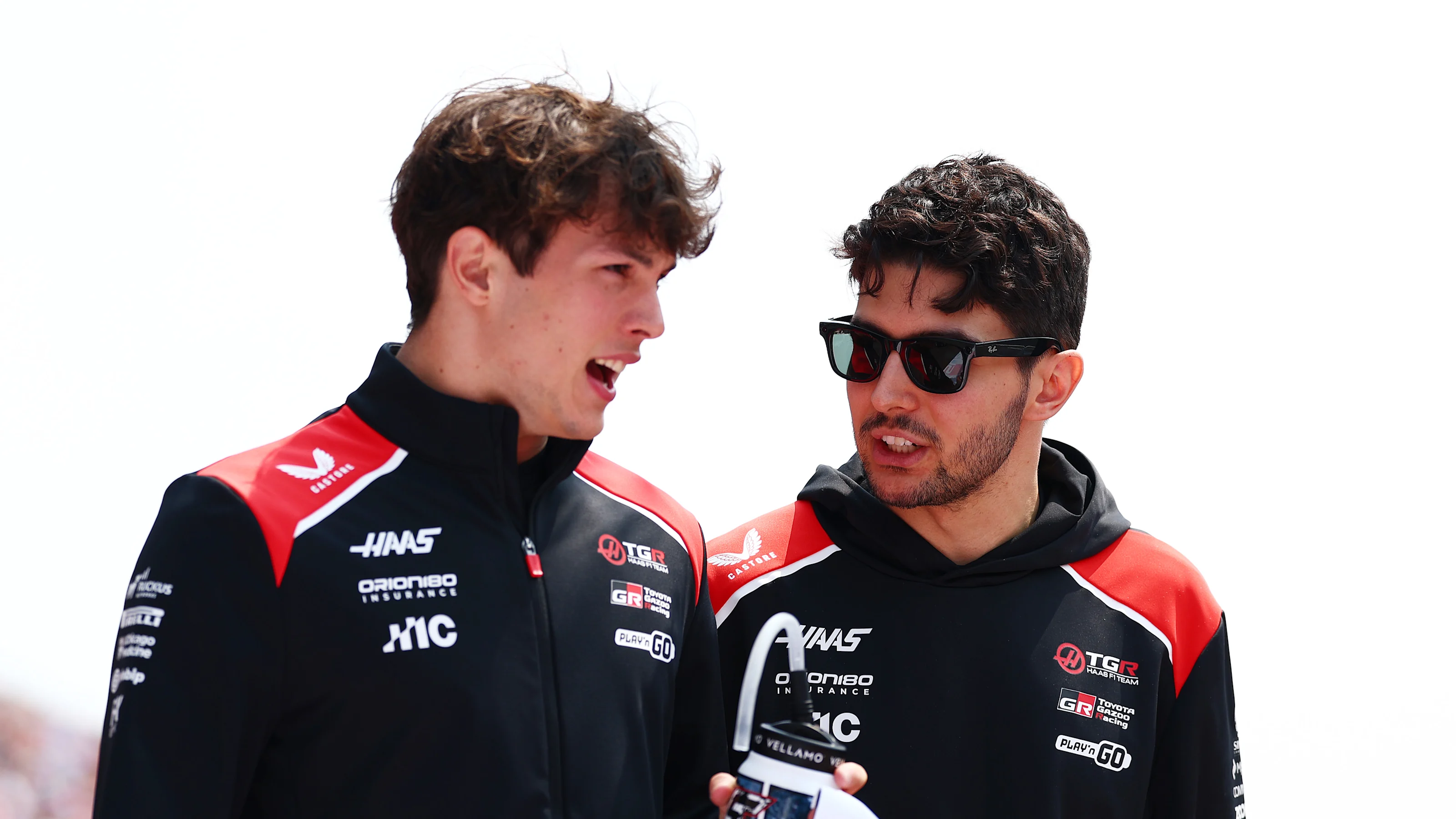 SUZUKA, JAPAN - MARCH 29: Oliver Bearman of Great Britain and Haas F1 and Esteban Ocon of France