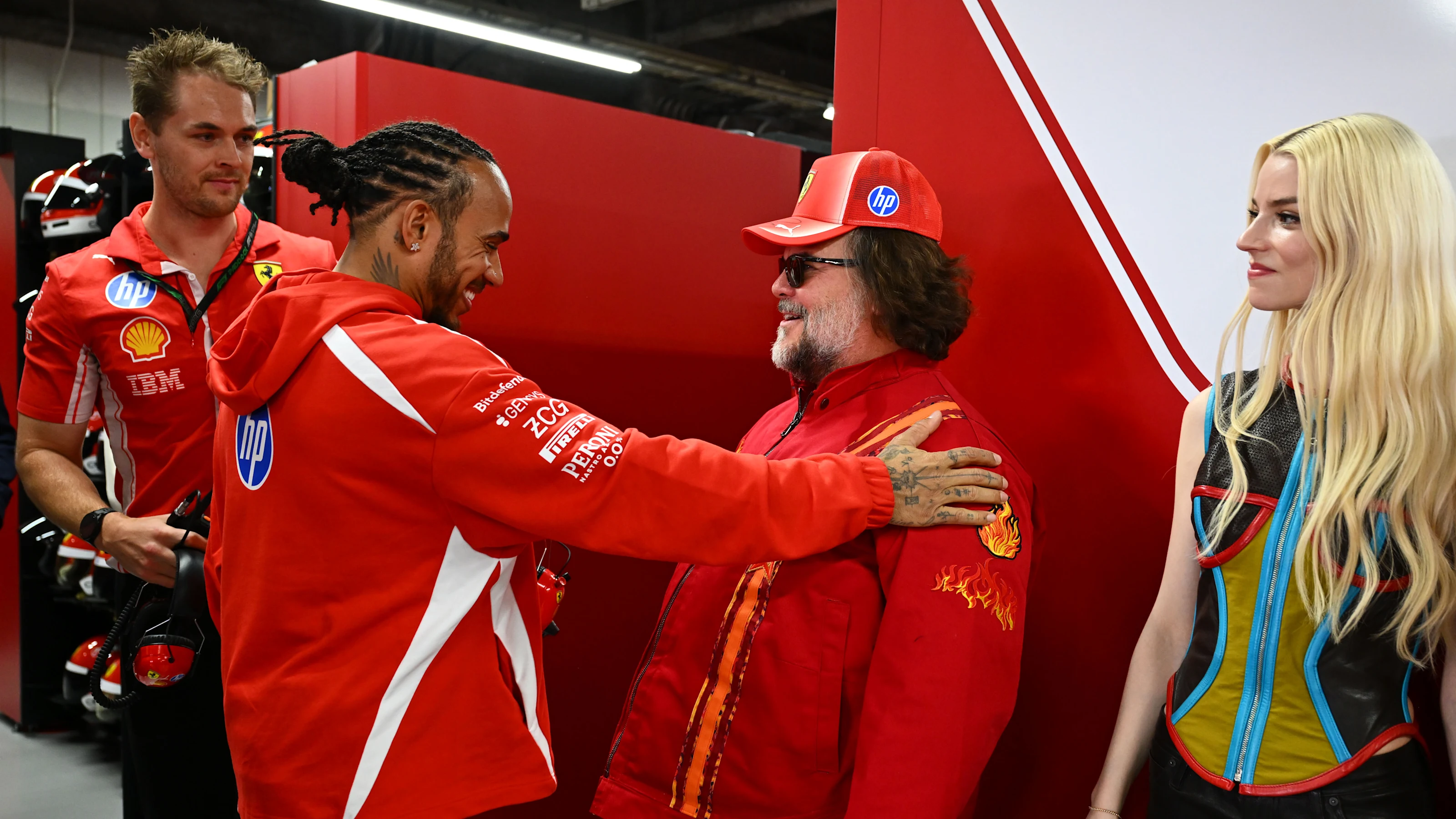 SUZUKA, JAPAN - MARCH 29: Lewis Hamilton of Great Britain and Scuderia Ferrari, Jack Black and