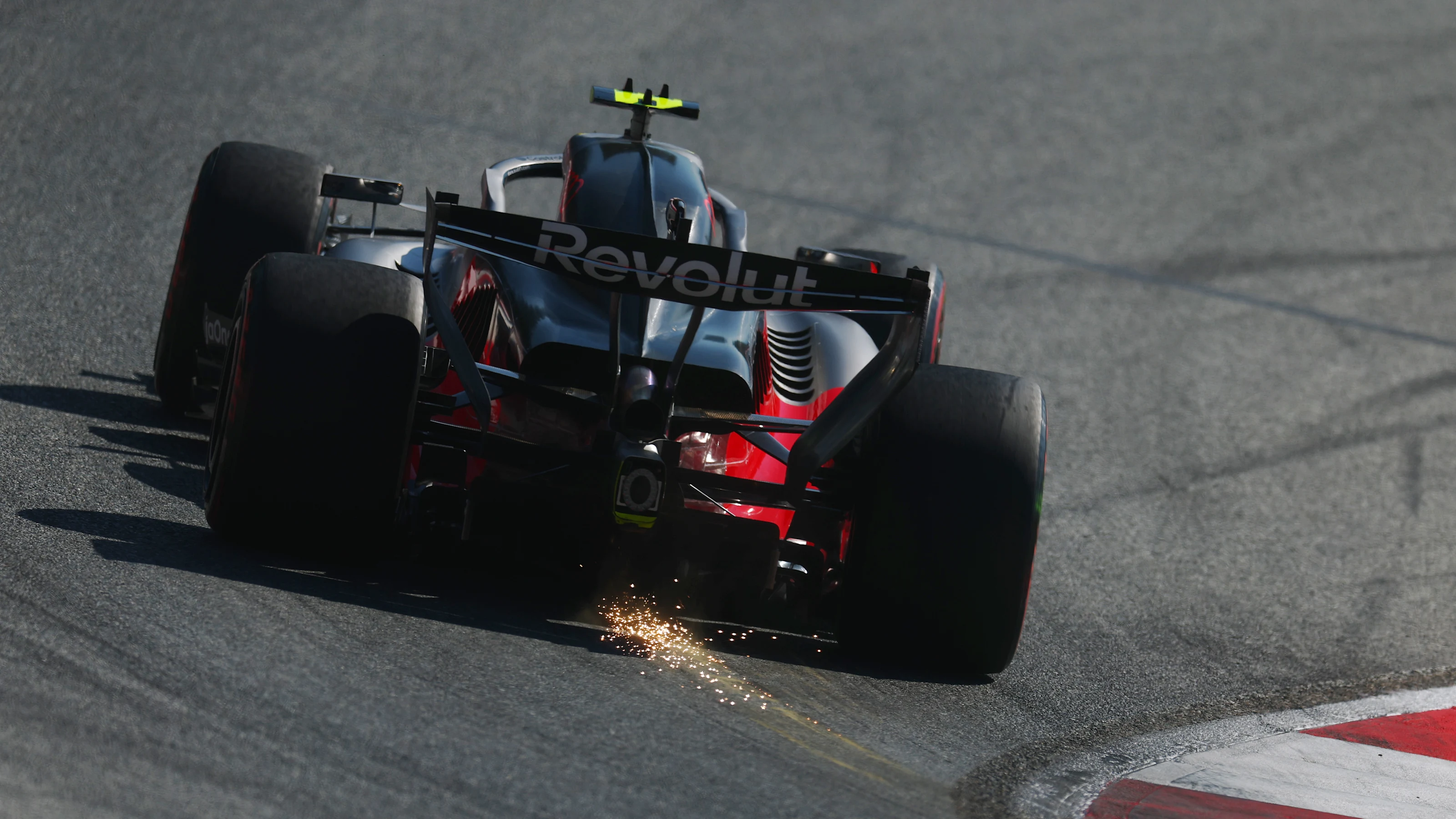 SPIELBERG, AUSTRIA - JUNE 27: Sparks fly behind Gabriel Bortoleto of Brazil driving the (5) Audi F1