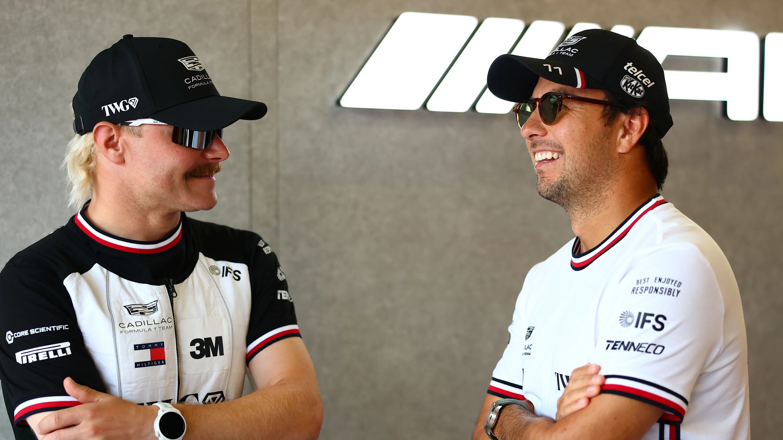 BAKU, AZERBAIJAN - SEPTEMBER 26: Valtteri Bottas of Finland and Cadillac F1 Team and Sergio Perez