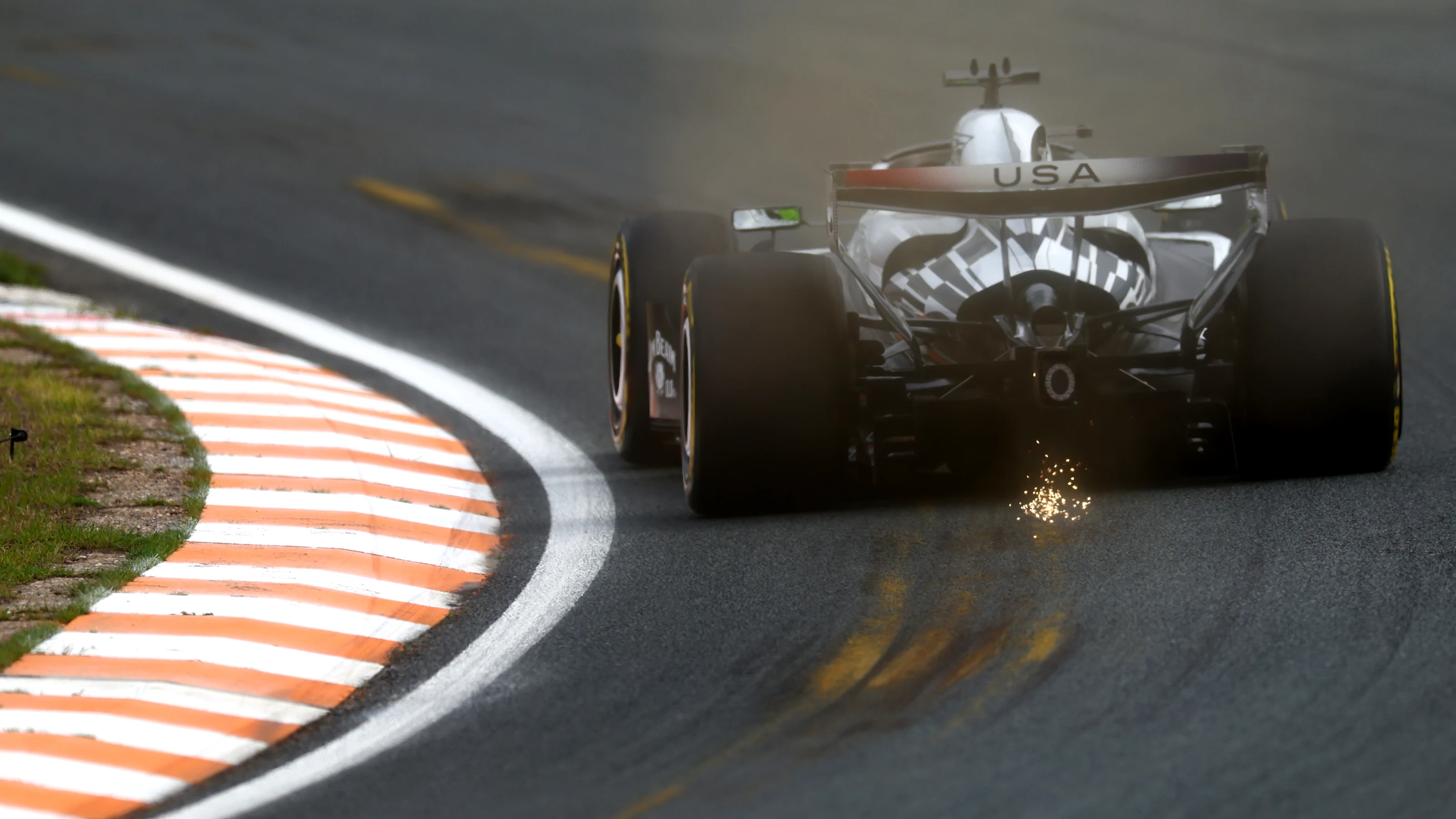 ZANDVOORT, NETHERLANDS - AUGUST 21: Sparks fly behind Sergio Perez of Mexico driving the (11)
