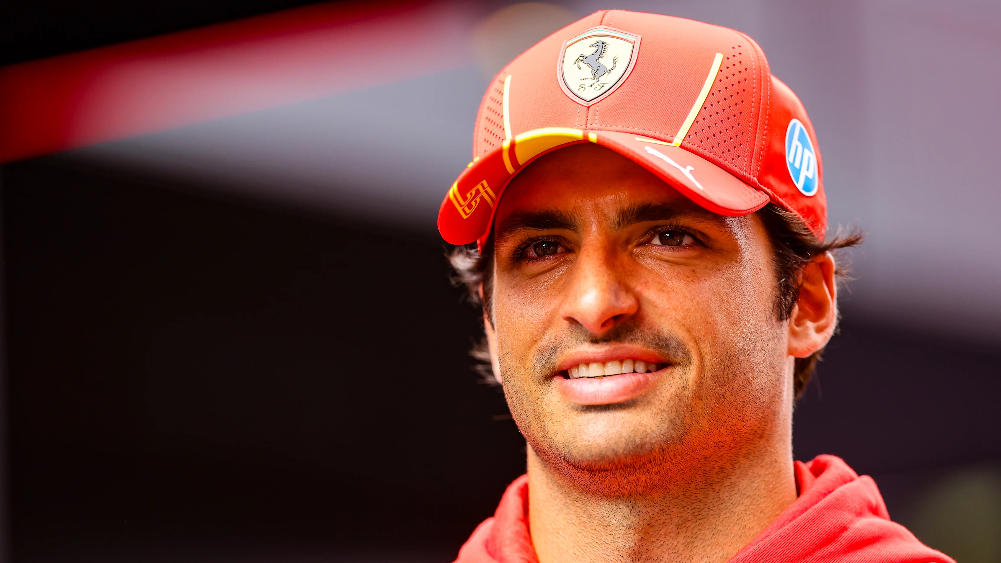 ZANDVOORT, NETHERLANDS - AUGUST 22: Carlos Sainz of Spain and Ferrari looks on in the paddock