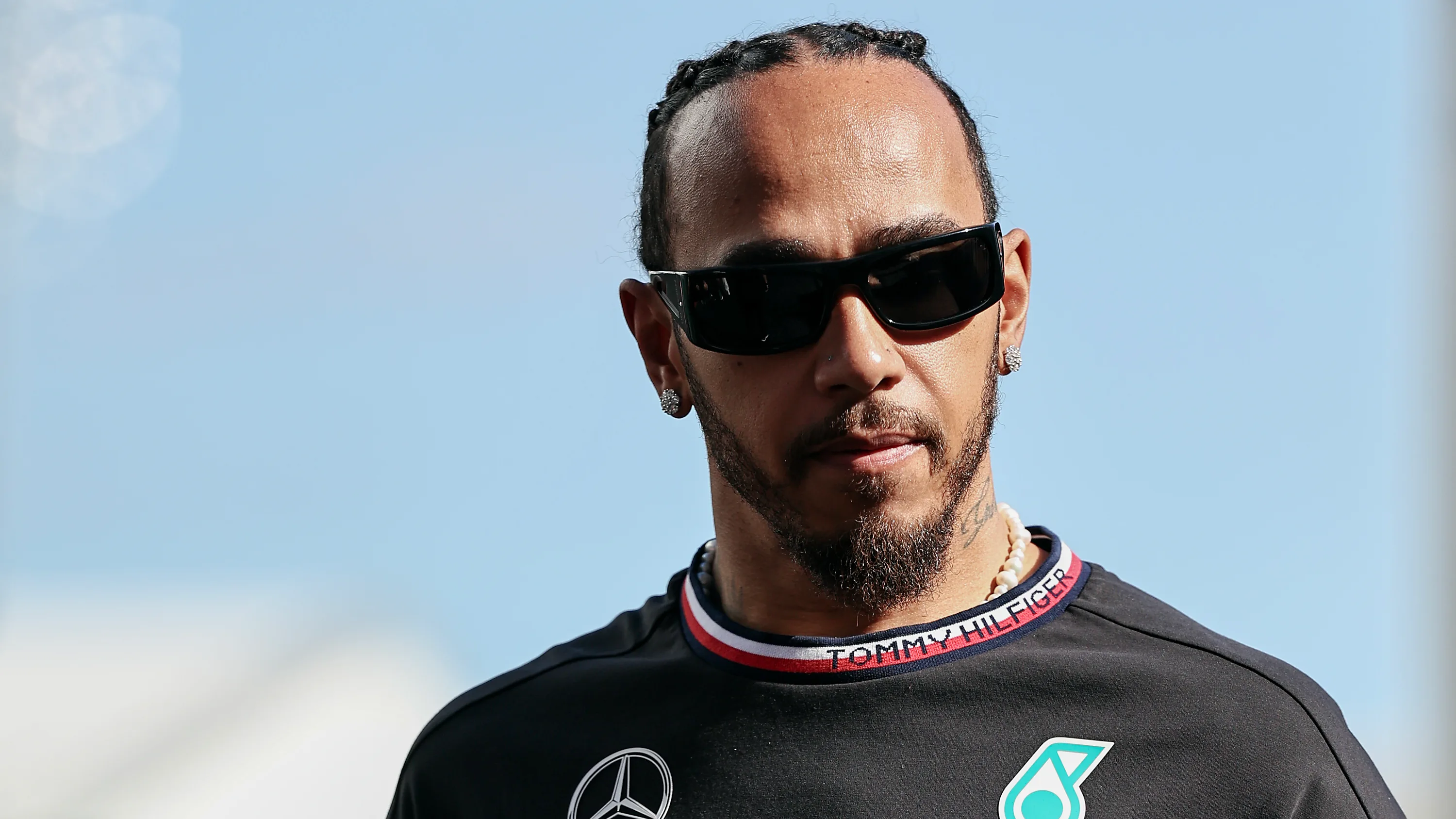 SINGAPORE, SINGAPORE - SEPTEMBER 21: Lewis Hamilton of Great Britain and Mercedes and George