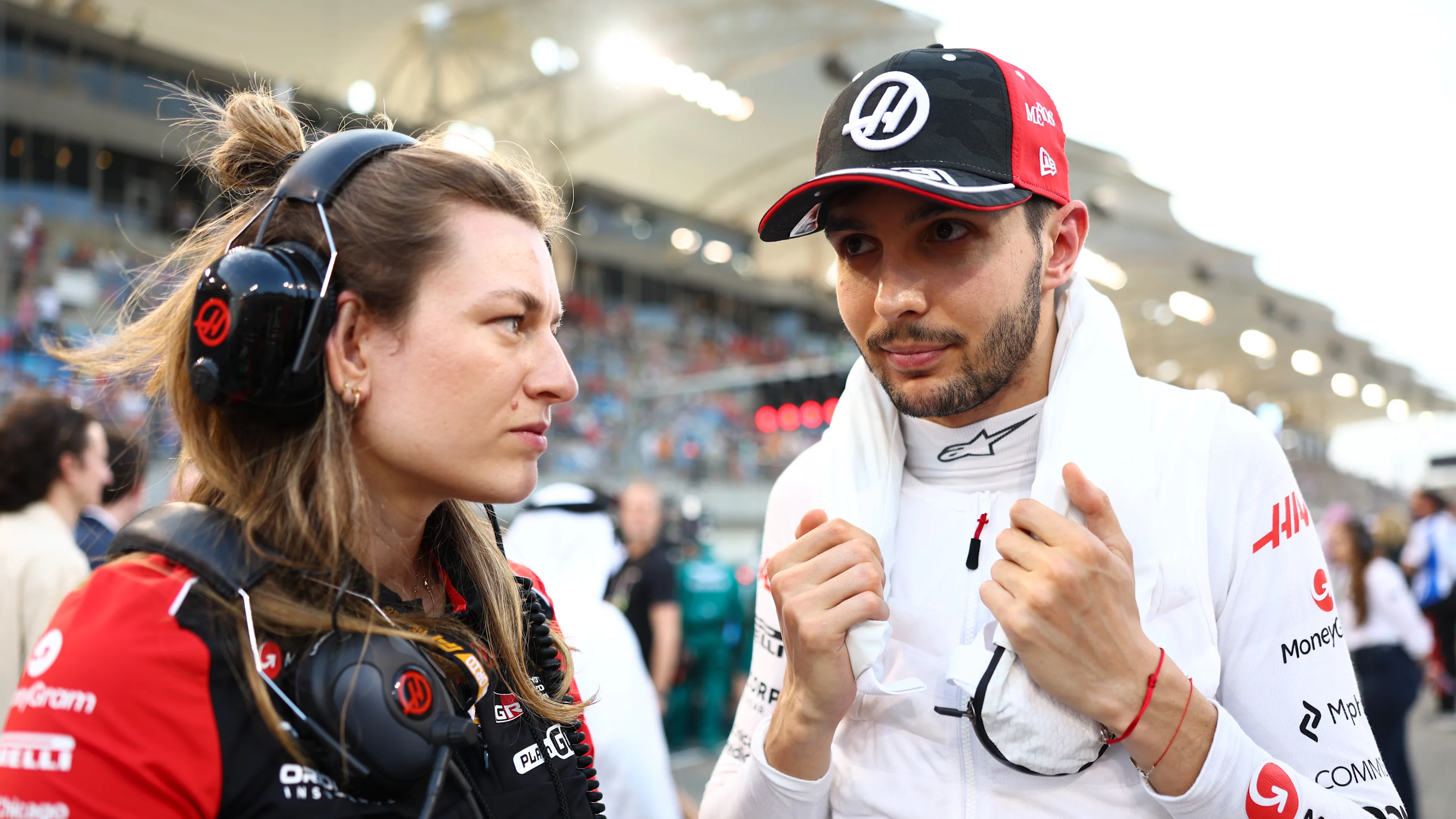 BAHRAIN, BAHRAIN - APRIL 13: Laura Mueller, Race Engineer of Haas F1 and Esteban Ocon of France and