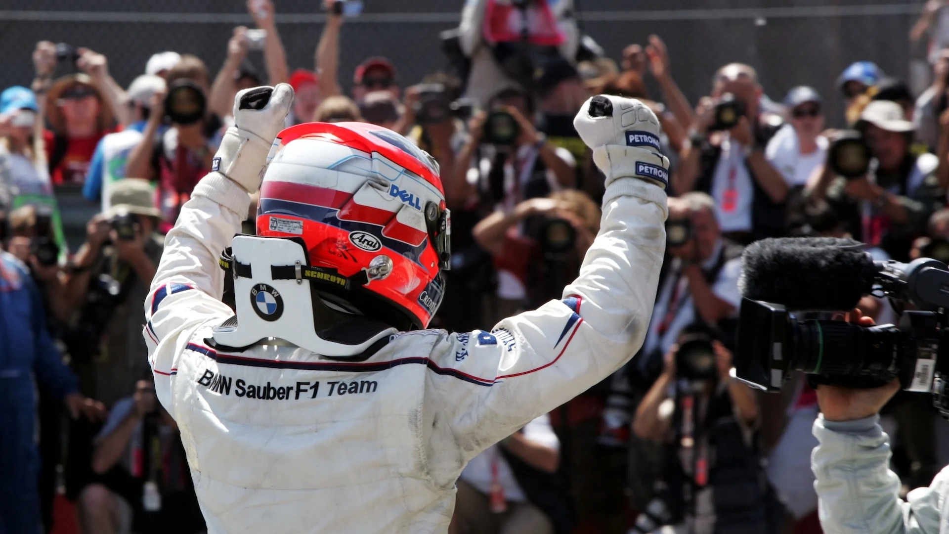 Robert Kubica (POL) BMW Sauber F1 celebrates his first win in parc ferme. Formula One World