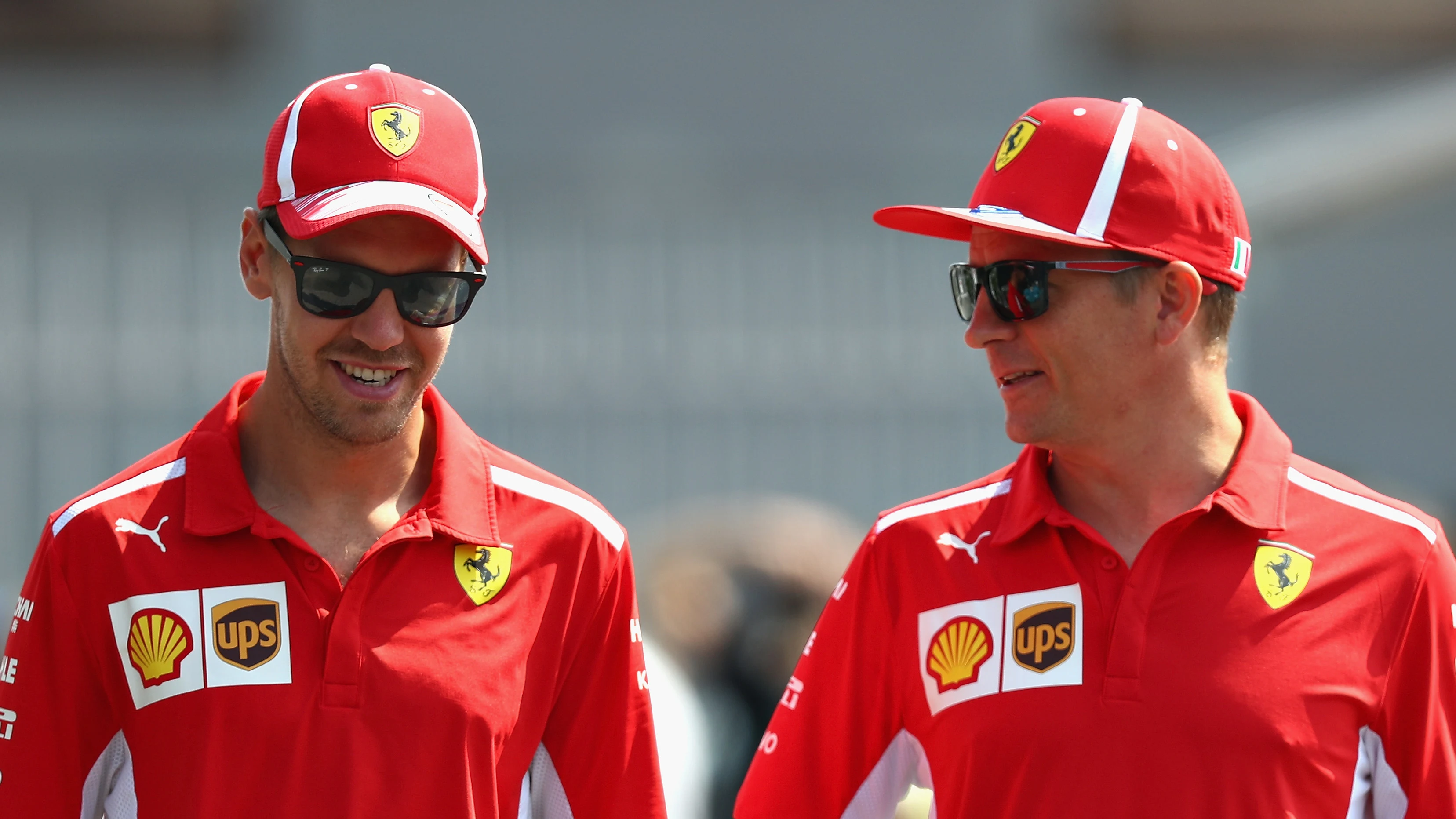 MONZA, ITALY - AUGUST 30: Sebastian Vettel of Germany and Ferrari and Kimi Raikkonen of Finland