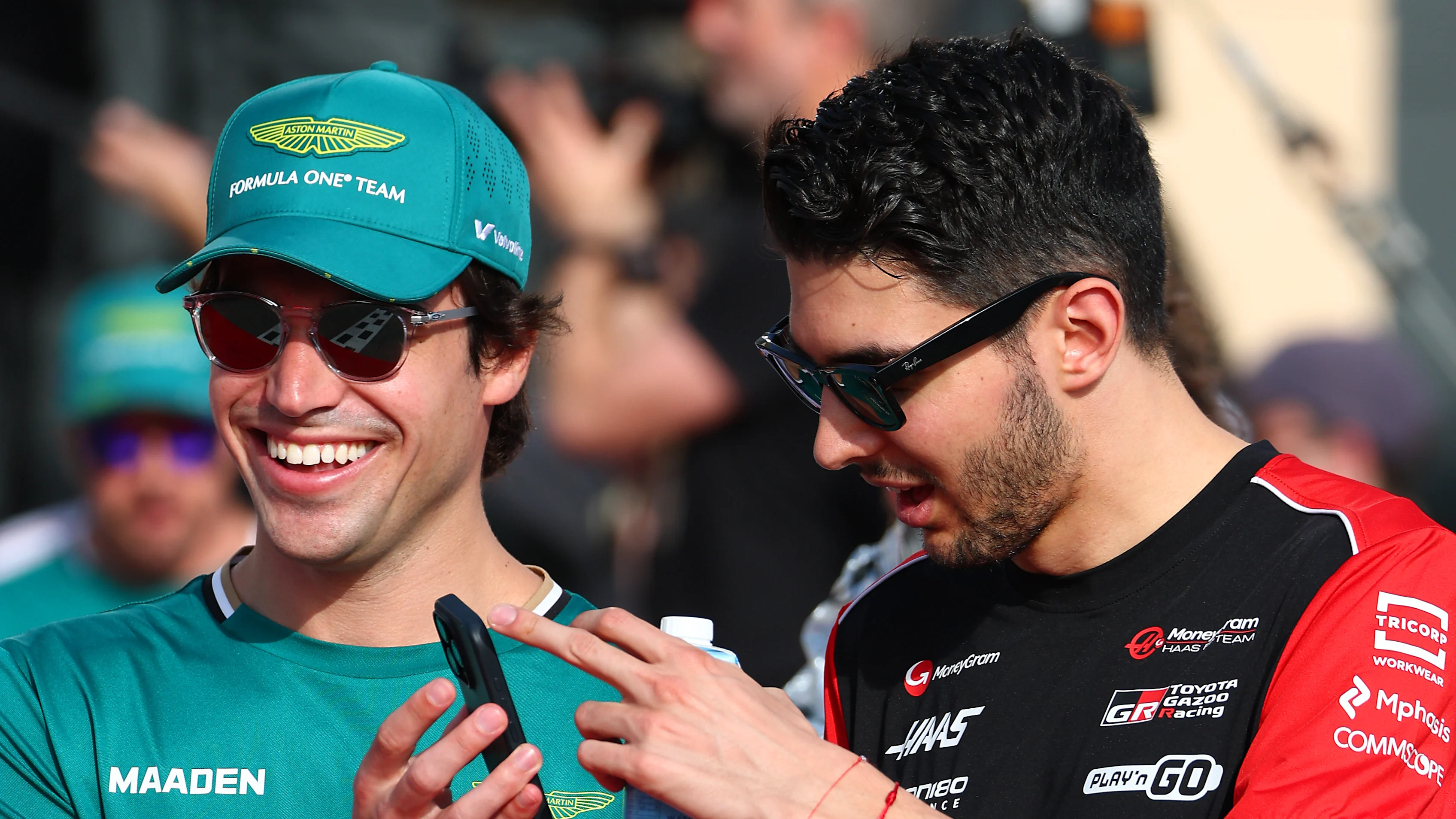 BAHRAIN, BAHRAIN - APRIL 13: Lance Stroll of Canada and Aston Martin F1 Team and Esteban Ocon of