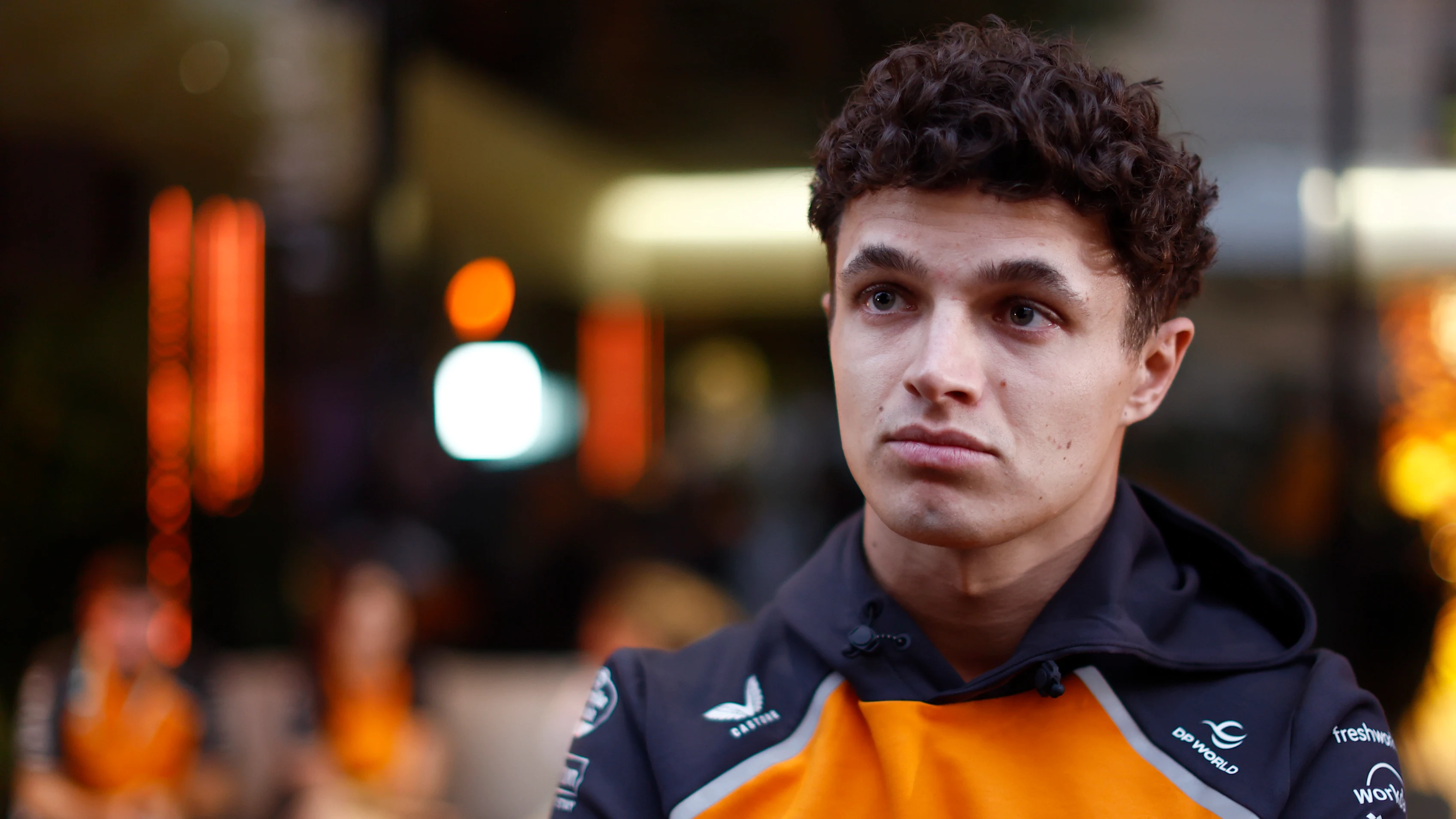 LUSAIL CITY, QATAR - NOVEMBER 27: Lando Norris of Great Britain and McLaren looks on in the Paddock