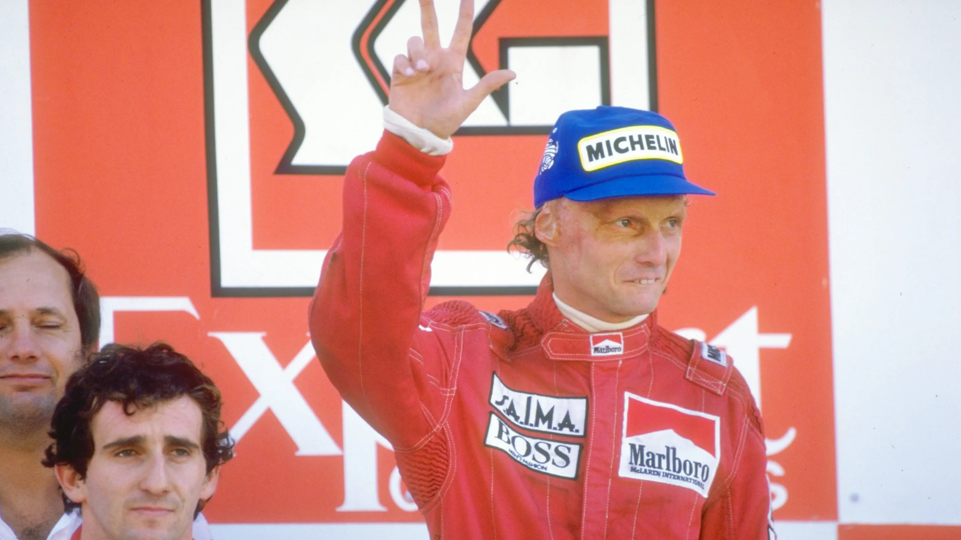 1984: Marlboro McLaren drivers Alain Prost of France and Niki Lauda of Austria stand on the