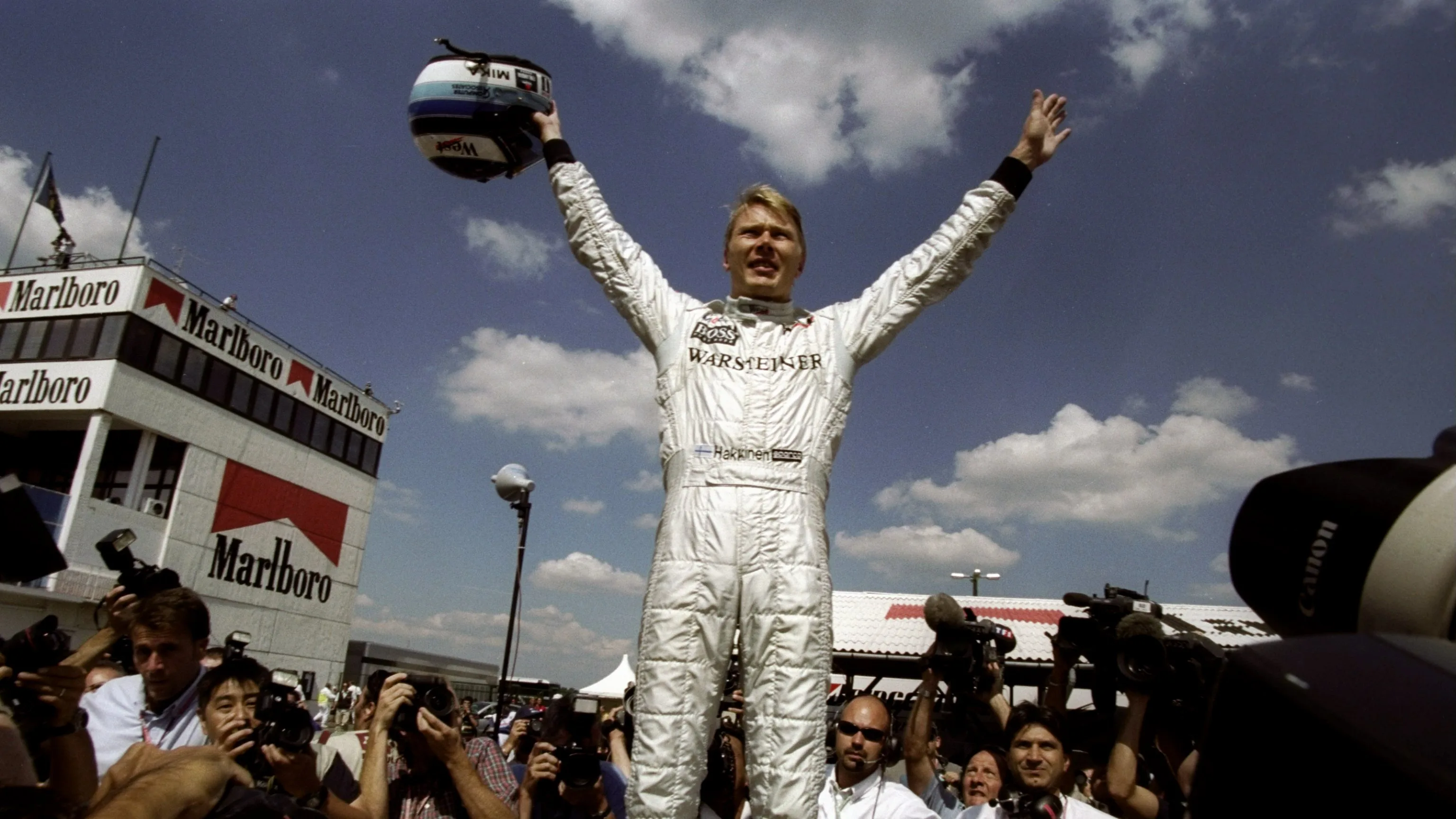 15 Aug 1999: Mika Hakkinen of Finland and the McLaren-Mercedes team celebrates winning the