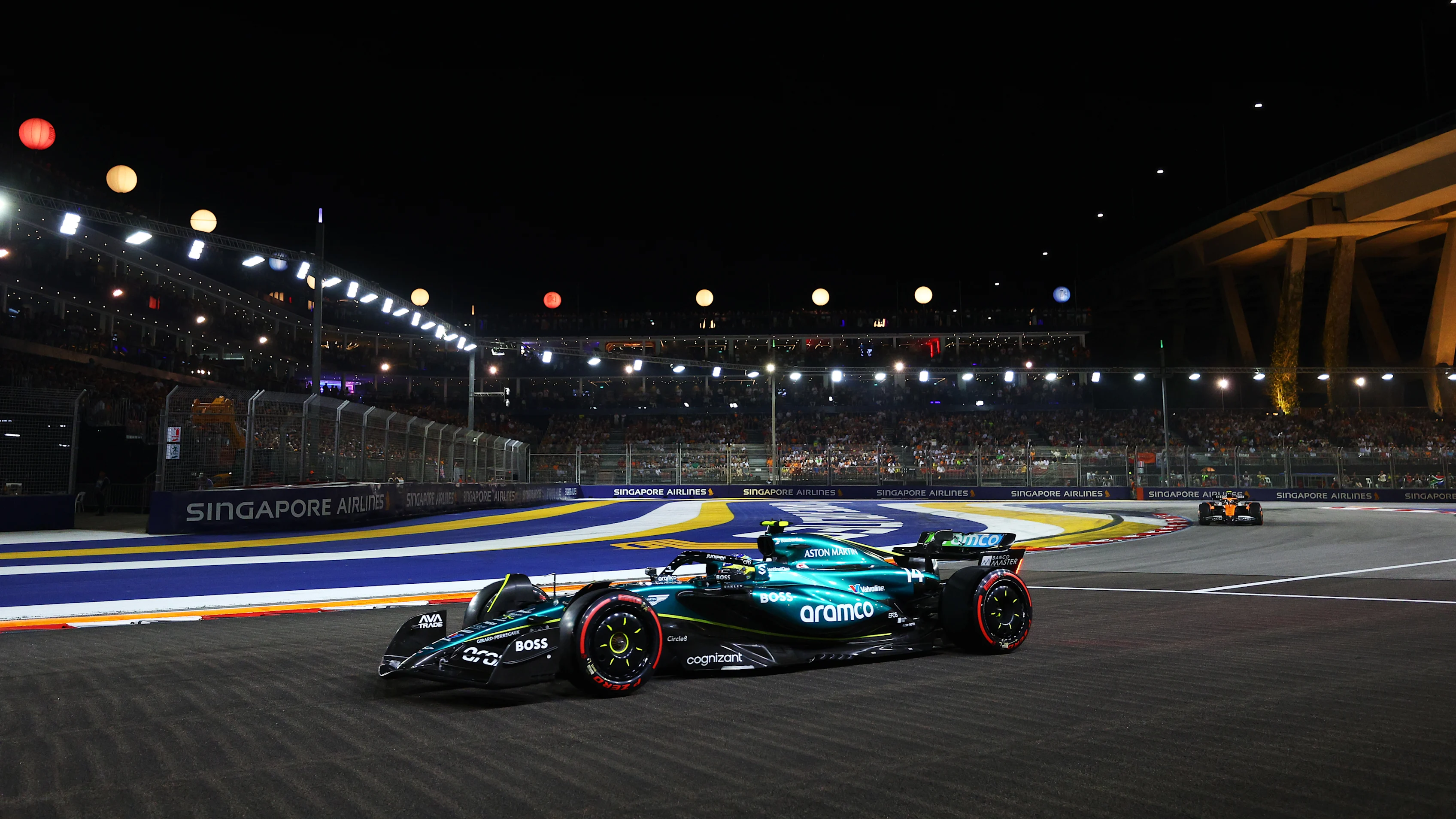SINGAPORE, SINGAPORE - SEPTEMBER 21: Fernando Alonso of Spain driving the (14) Aston Martin AMR24
