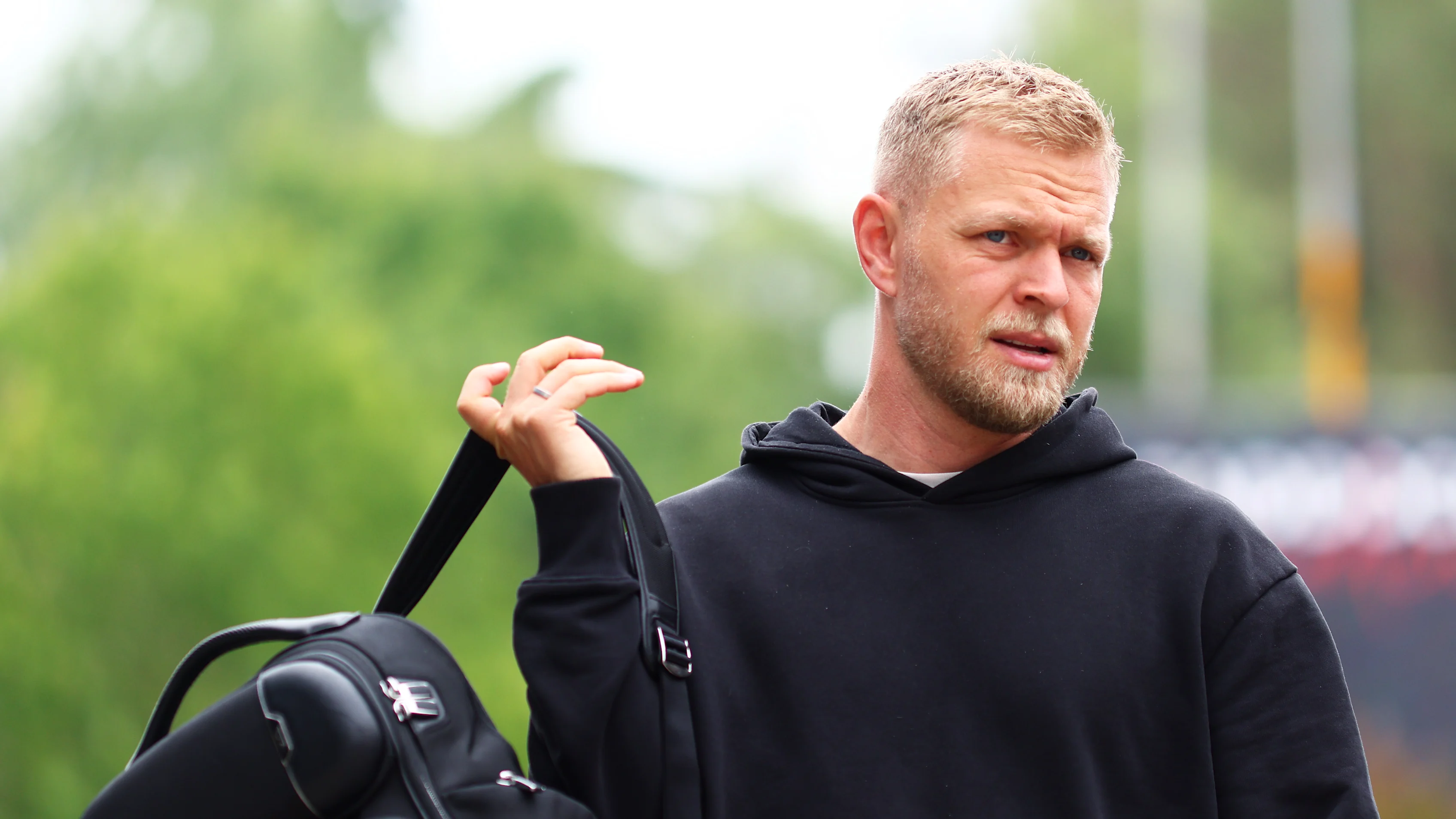 IMOLA, ITALY - MAY 16: Kevin Magnussen of Denmark and Haas F1 walks in the Paddock during previews