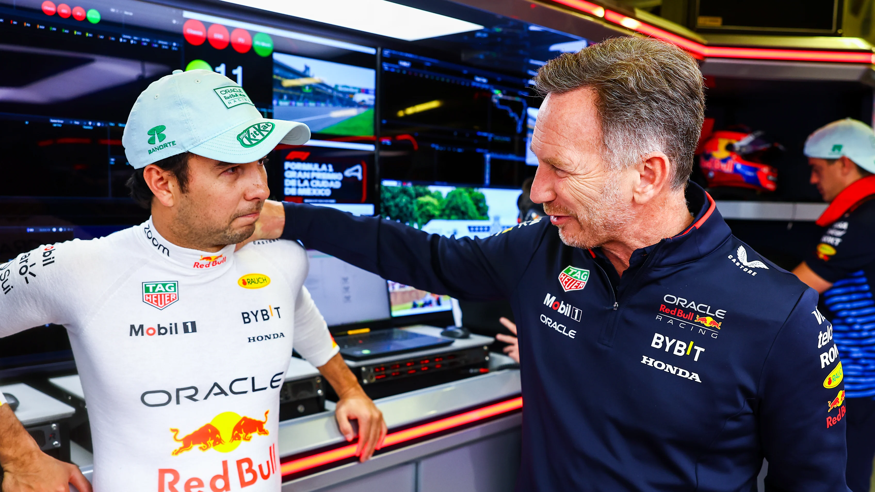 SPA, BELGIUM - JULY 28: Sergio Perez of Mexico and Oracle Red Bull Racing talks to Oracle Red Bull