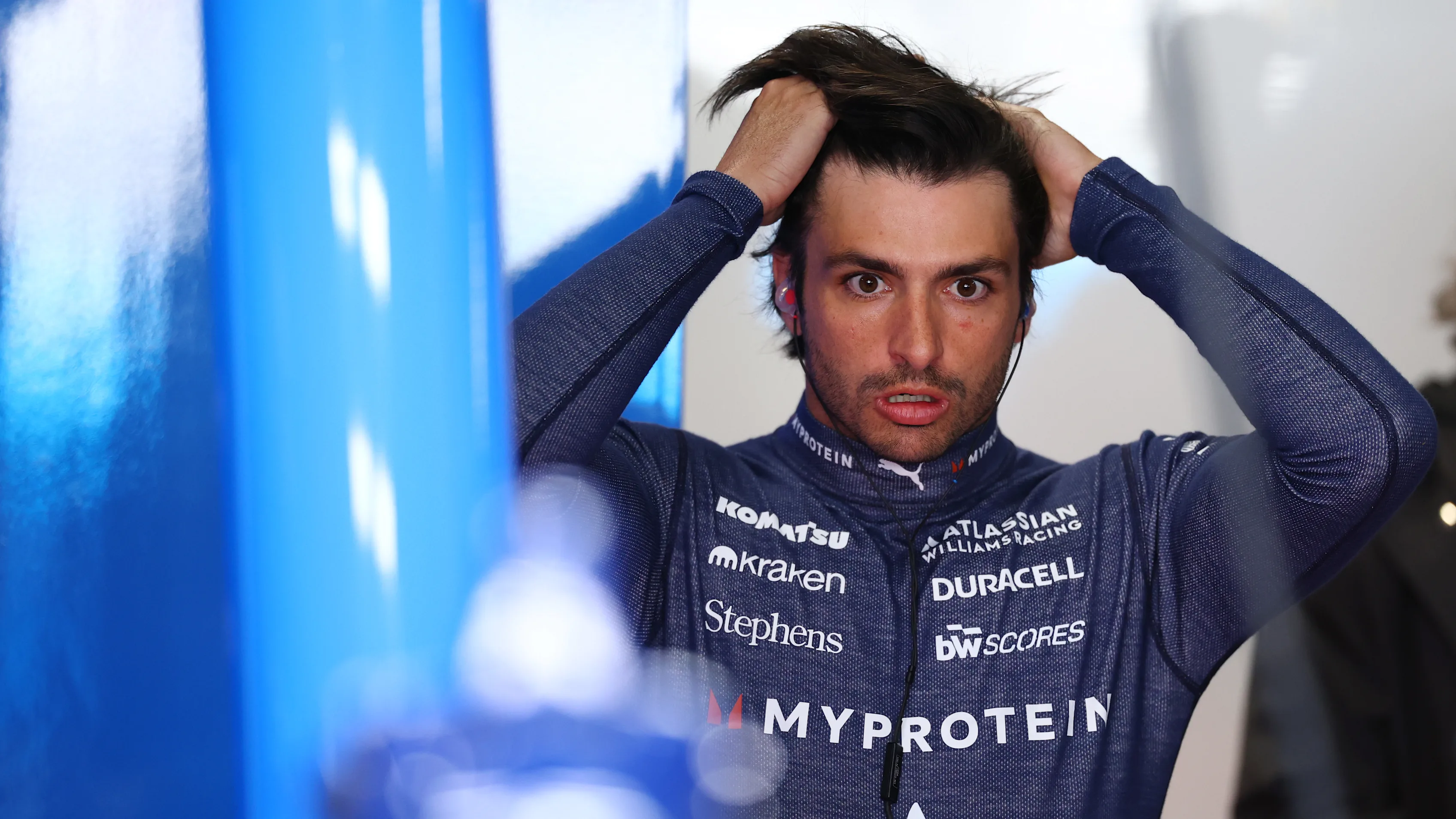 SUZUKA, JAPAN - APRIL 04: Carlos Sainz of Spain and Williams looks on in the garage during practice