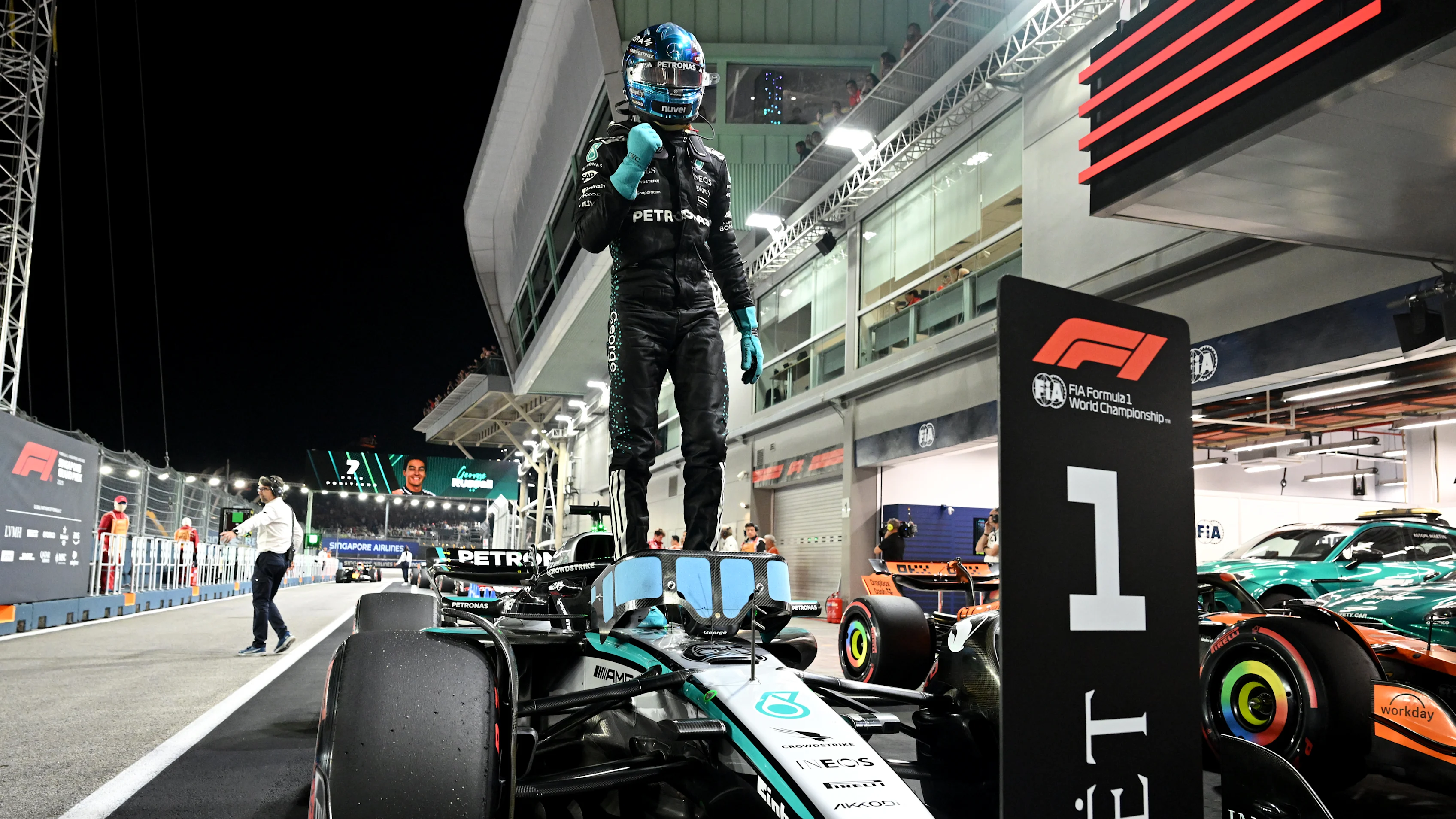 SINGAPORE, SINGAPORE - OCTOBER 04: Pole position qualifier George Russell of Great Britain and