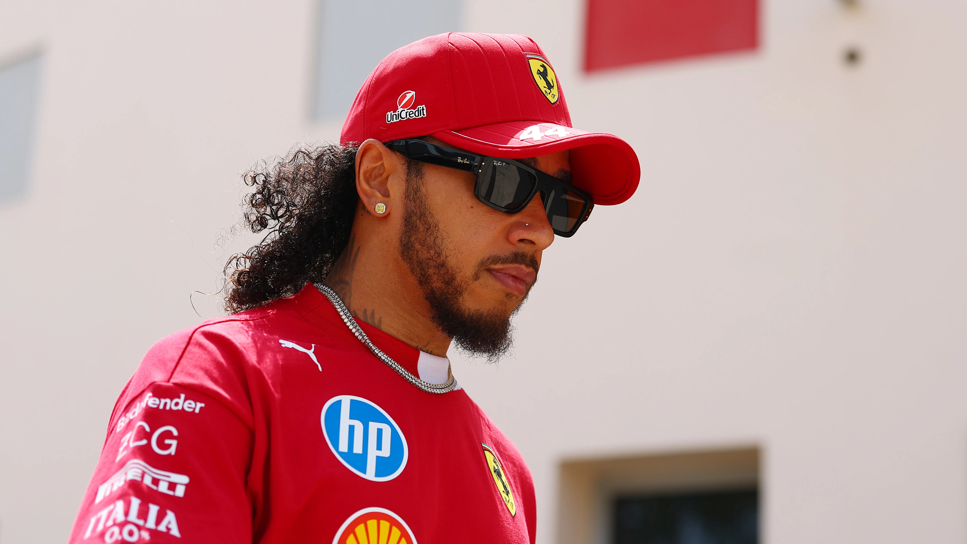 BAHRAIN, BAHRAIN - APRIL 10: Lewis Hamilton of Great Britain and Scuderia Ferrari walks in the