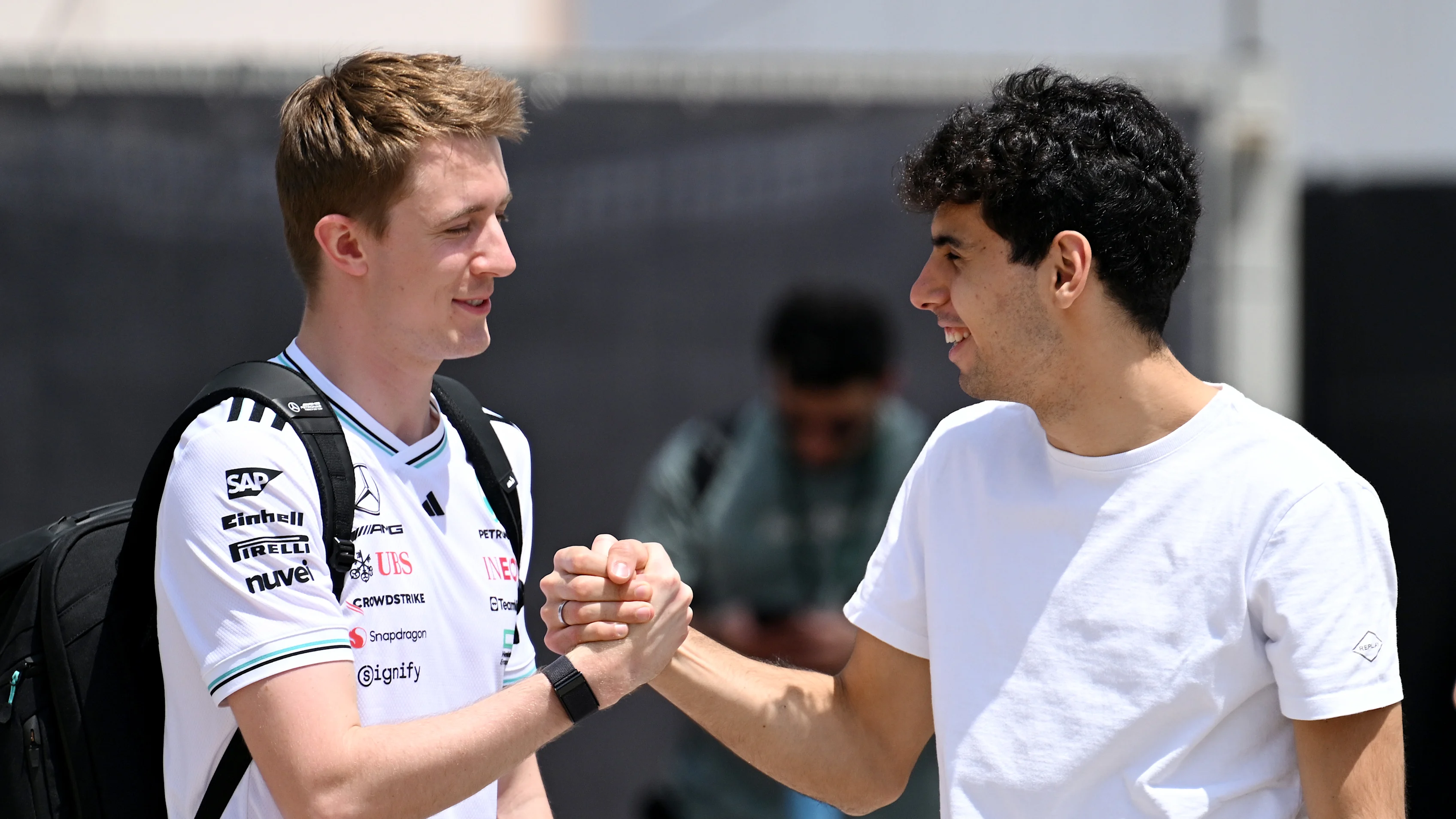 BAHRAIN, BAHRAIN - APRIL 10: Frederik Vesti of Denmark and Mercedes  talks with Gabriel Bortoleto