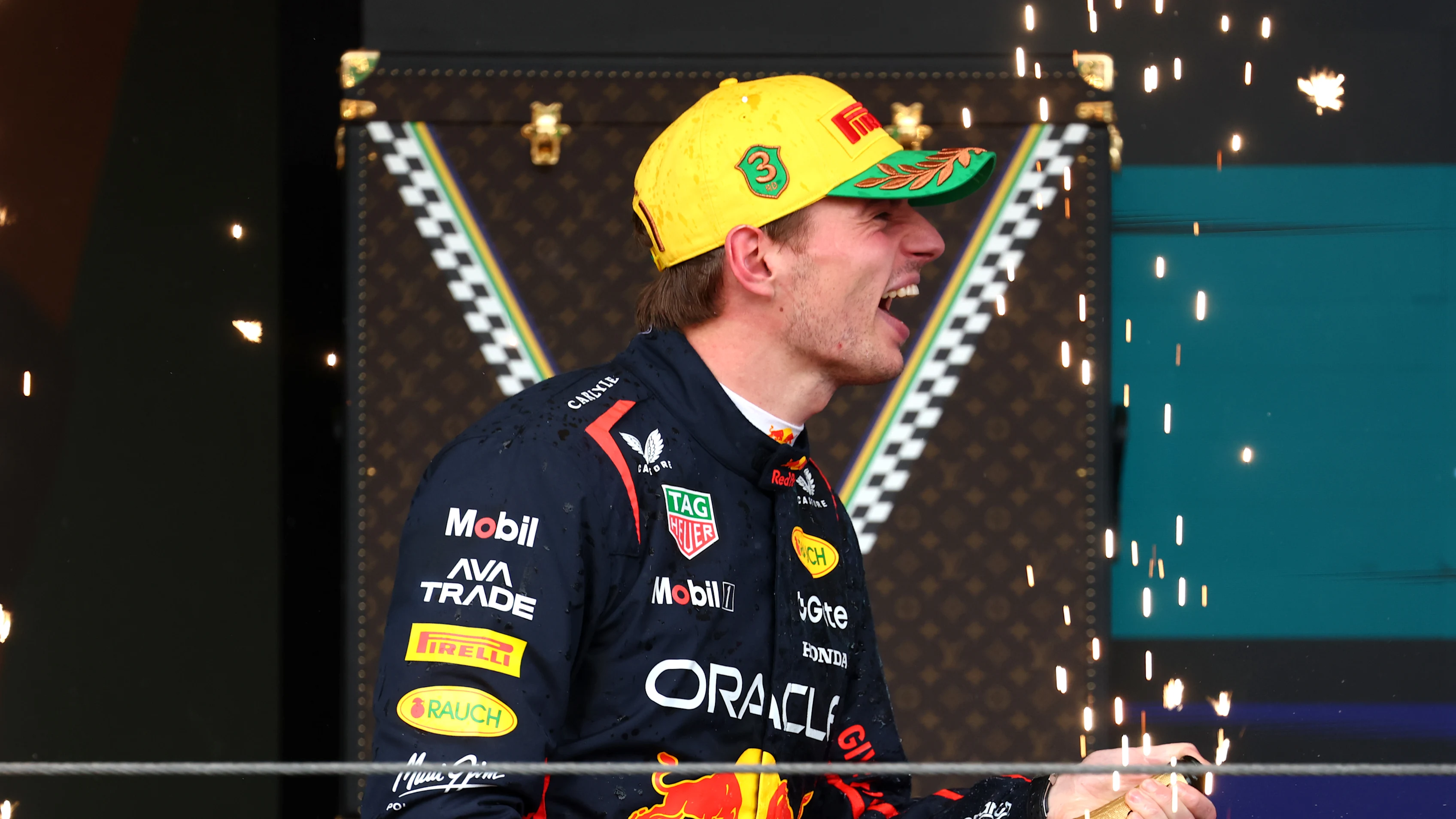 SAO PAULO, BRAZIL - NOVEMBER 09: Third placed Max Verstappen of the Netherlands and Oracle Red Bull Racing sprays Champagne on the podium during the F1 Grand Prix of Brazil at Autodromo Jose Carlos Pace on November 09, 2025 in Sao Paulo, Brazil. (Photo by Mark Thompson/Getty Images)