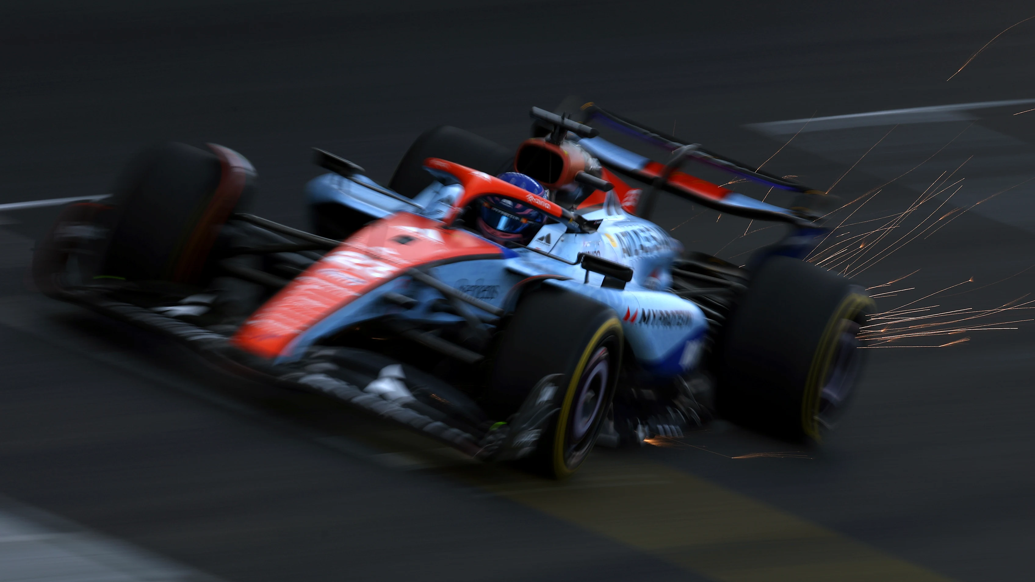 SAO PAULO, BRAZIL - NOVEMBER 07: Sparks fly behind Alexander Albon of Thailand driving the (23) Williams FW47 Mercedes on track during Sprint Qualifying ahead of the F1 Grand Prix of Brazil at Autodromo Jose Carlos Pace on November 07, 2025 in Sao Paulo, Brazil. (Photo by Mark Thompson/Getty Images)