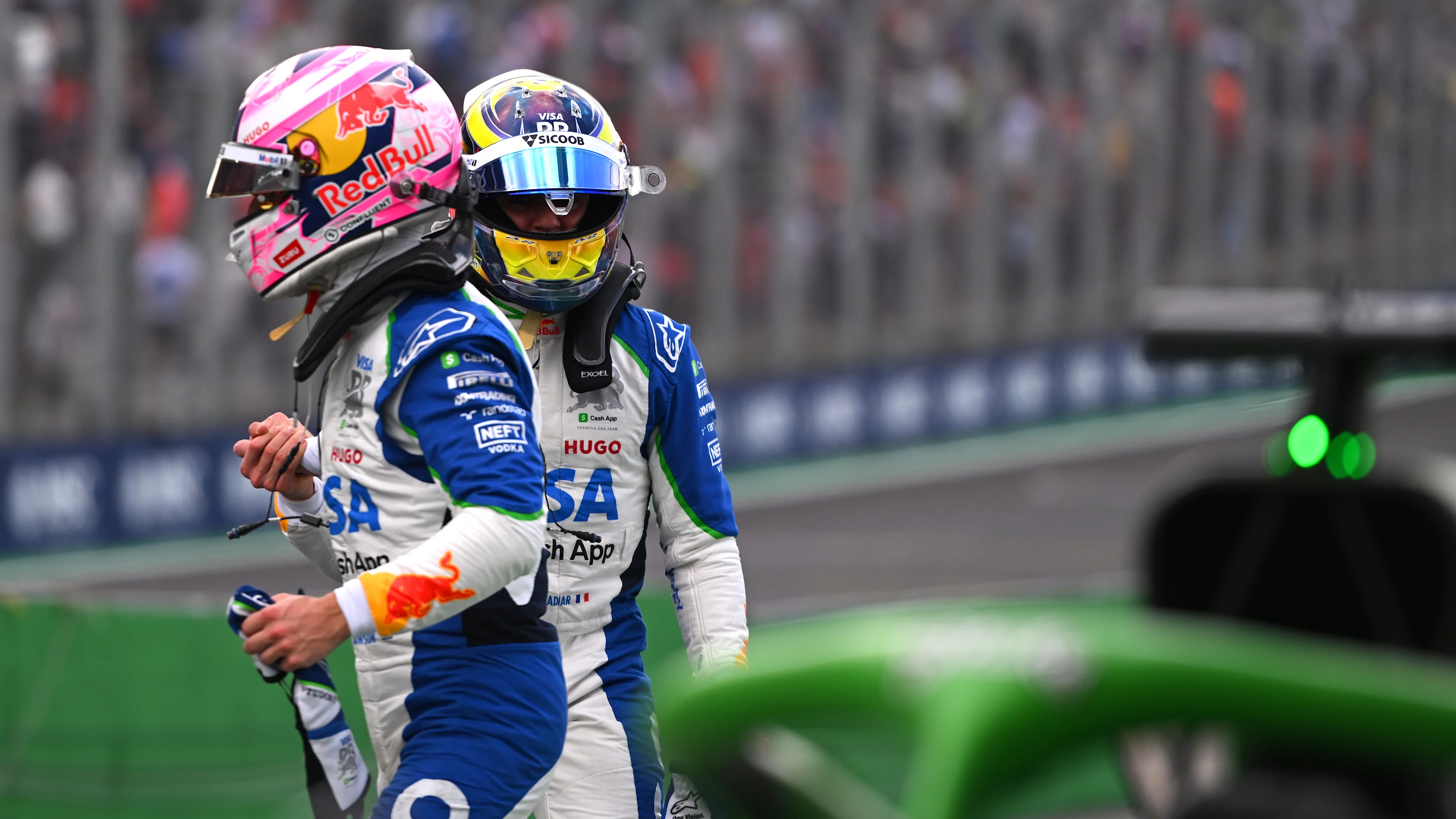 SAO PAULO, BRAZIL - NOVEMBER 08: Seventh placed qualifier Liam Lawson of New Zealand and Visa Cash App Racing Bulls and Fifth placed qualifier Isack Hadjar of France and Visa Cash App Racing Bulls congratulate each other in parc ferme during qualifying ahead of the F1 Grand Prix of Brazil at Autodromo Jose Carlos Pace on November 08, 2025 in Sao Paulo, Brazil. (Photo by Rudy Carezzevoli/Getty Images)