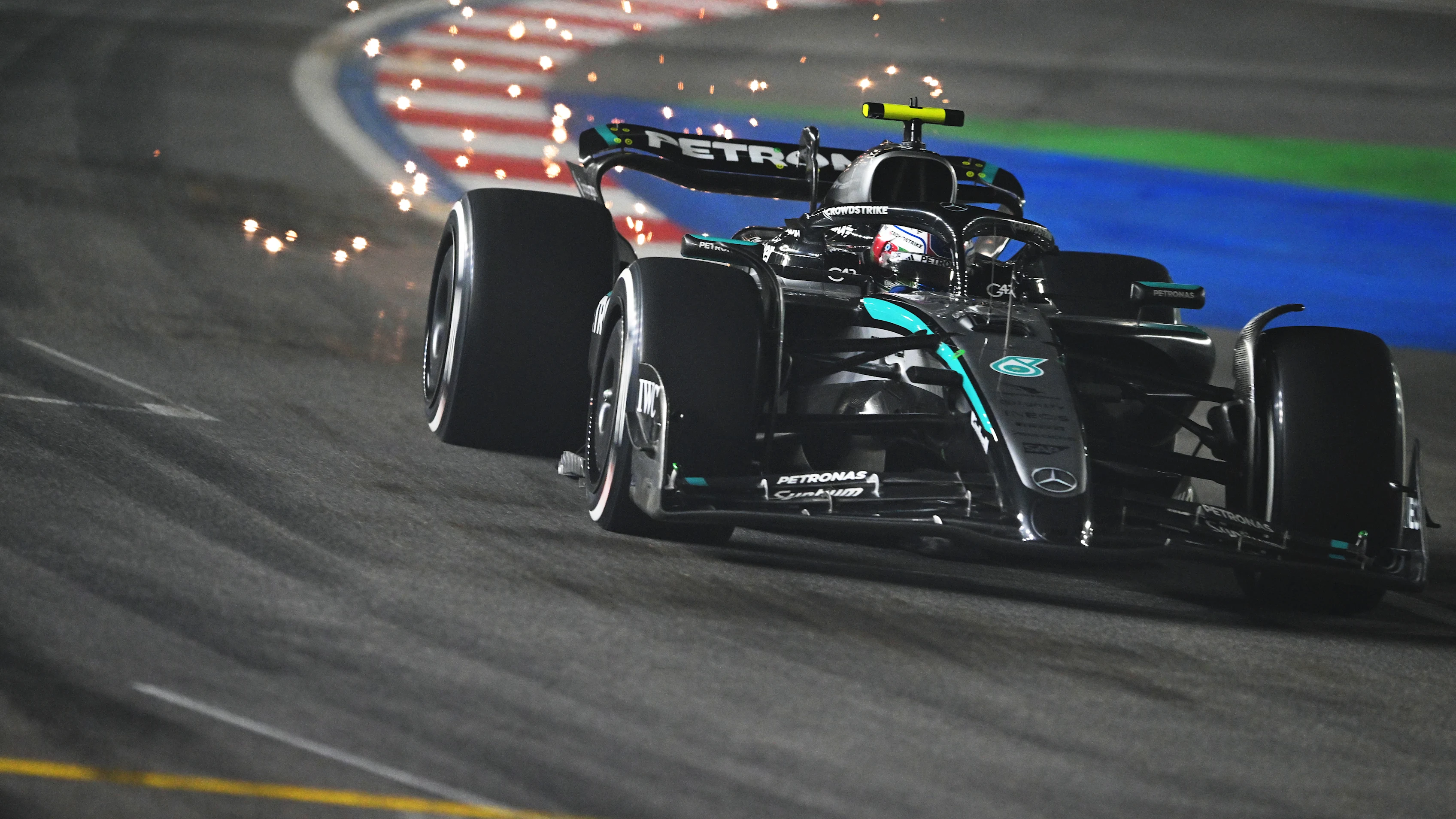 LAS VEGAS, NEVADA - NOVEMBER 22: Sparks fly behind Andrea Kimi Antonelli of Italy driving the (12)