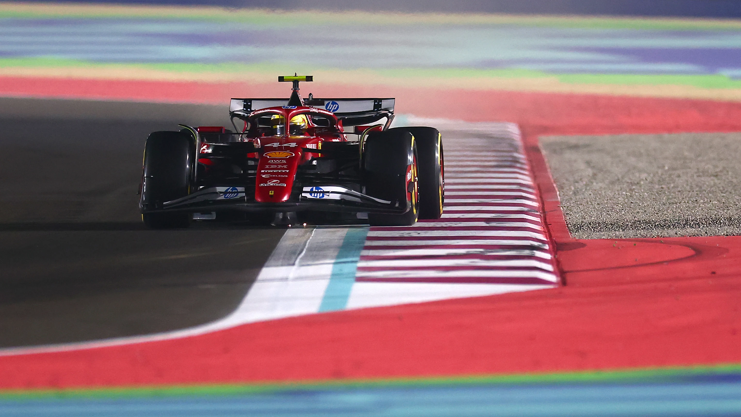 LUSAIL CITY, QATAR - NOVEMBER 28: Lewis Hamilton of Great Britain driving the (44) Scuderia Ferrari