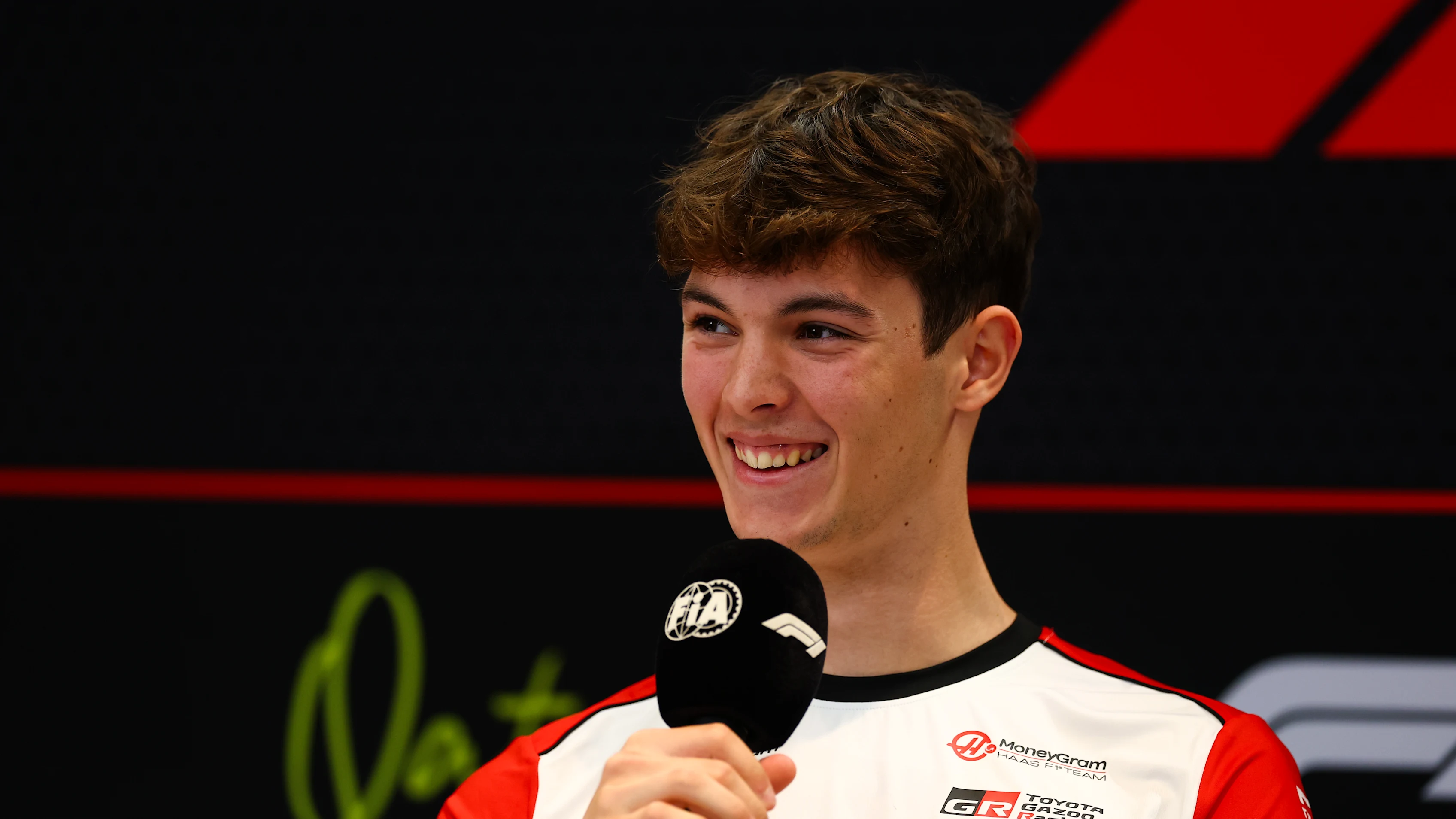 LUSAIL CITY, QATAR - NOVEMBER 27: Oliver Bearman of Great Britain and Haas F1 speaks in the Drivers