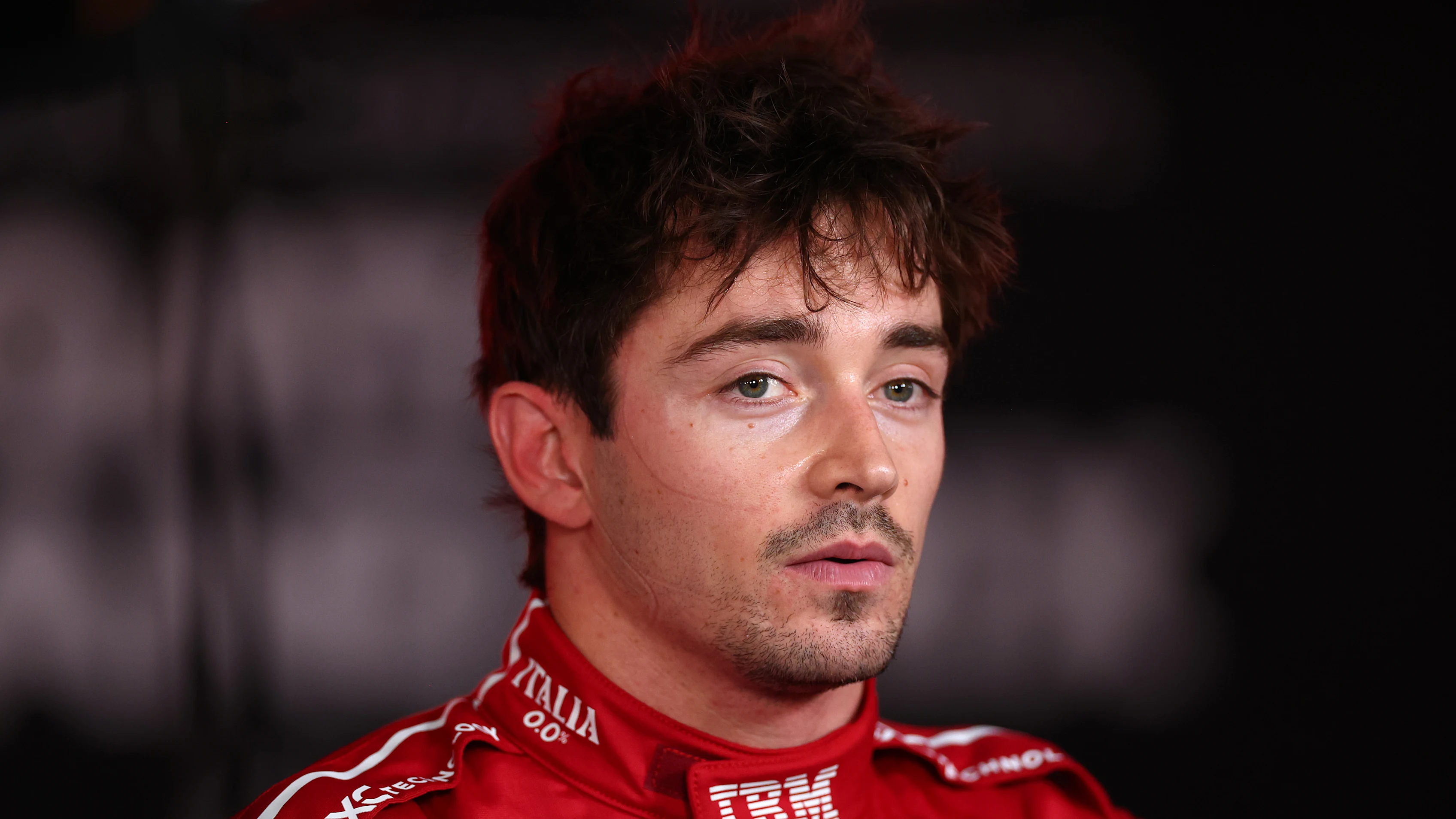 LUSAIL CITY, QATAR - NOVEMBER 29: Thirteenth placed Charles Leclerc of Monaco and Scuderia Ferrari is interviewed during the Sprint ahead of the F1 Grand Prix of Qatar at Lusail International Circuit on November 29, 2025 in Lusail City, Qatar. (Photo by Peter Fox/Getty Images)