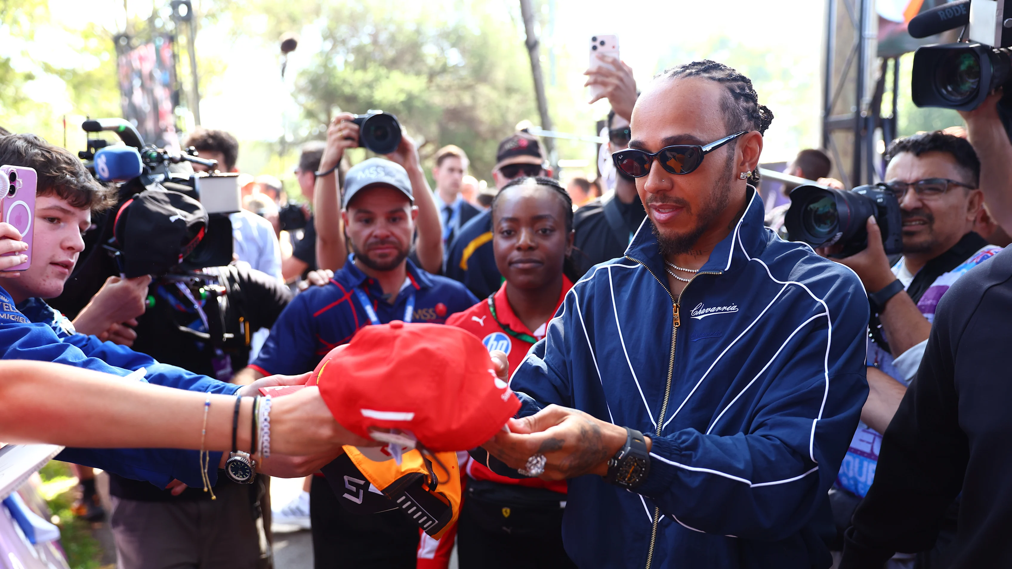 MELBOURNE, AUSTRALIA - MARCH 05: Lewis Hamilton of Great Britain and Scuderia Ferrari signs