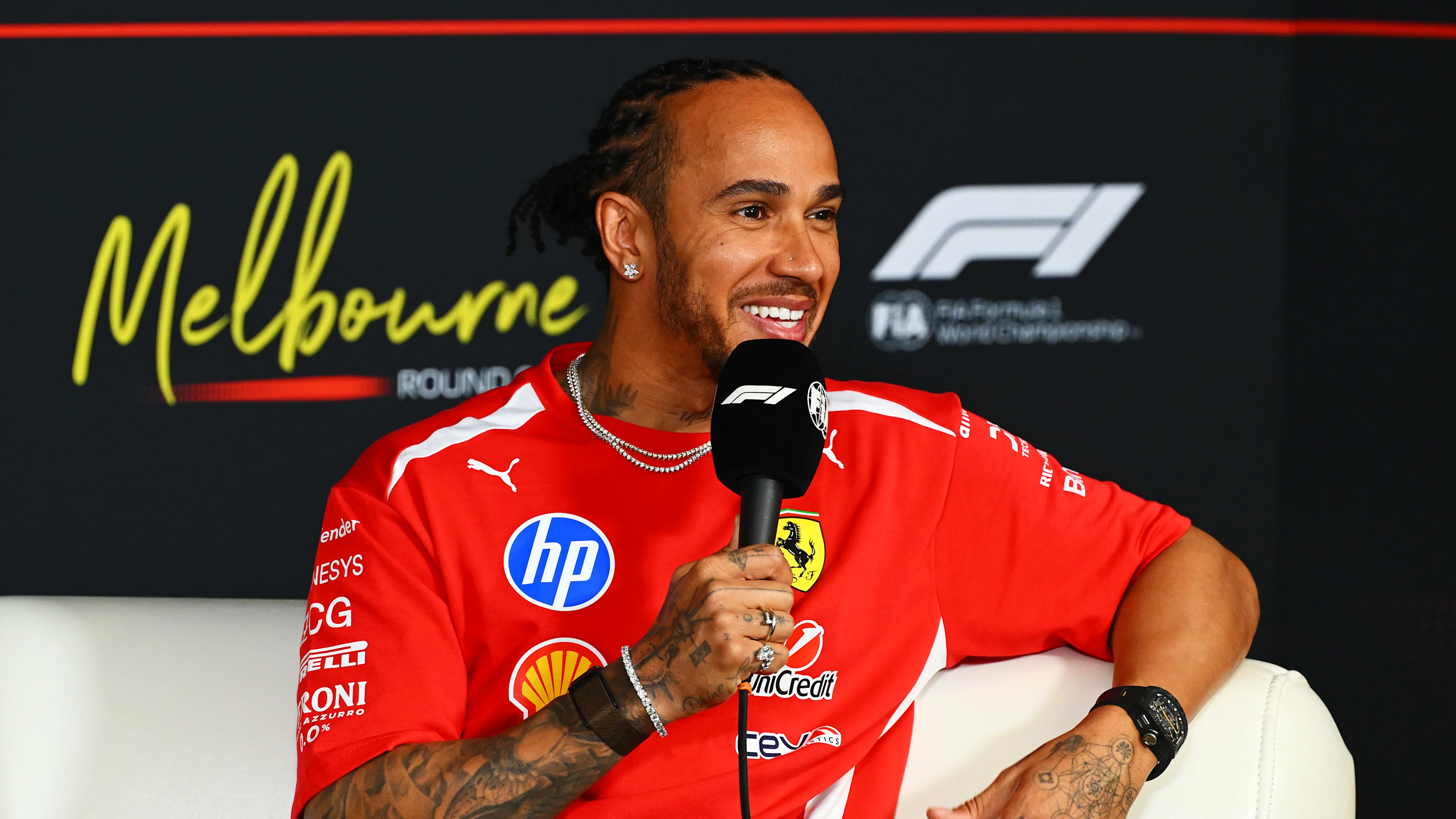 MELBOURNE, AUSTRALIA - MARCH 05: Lewis Hamilton of Great Britain and Scuderia Ferrari speaks in the