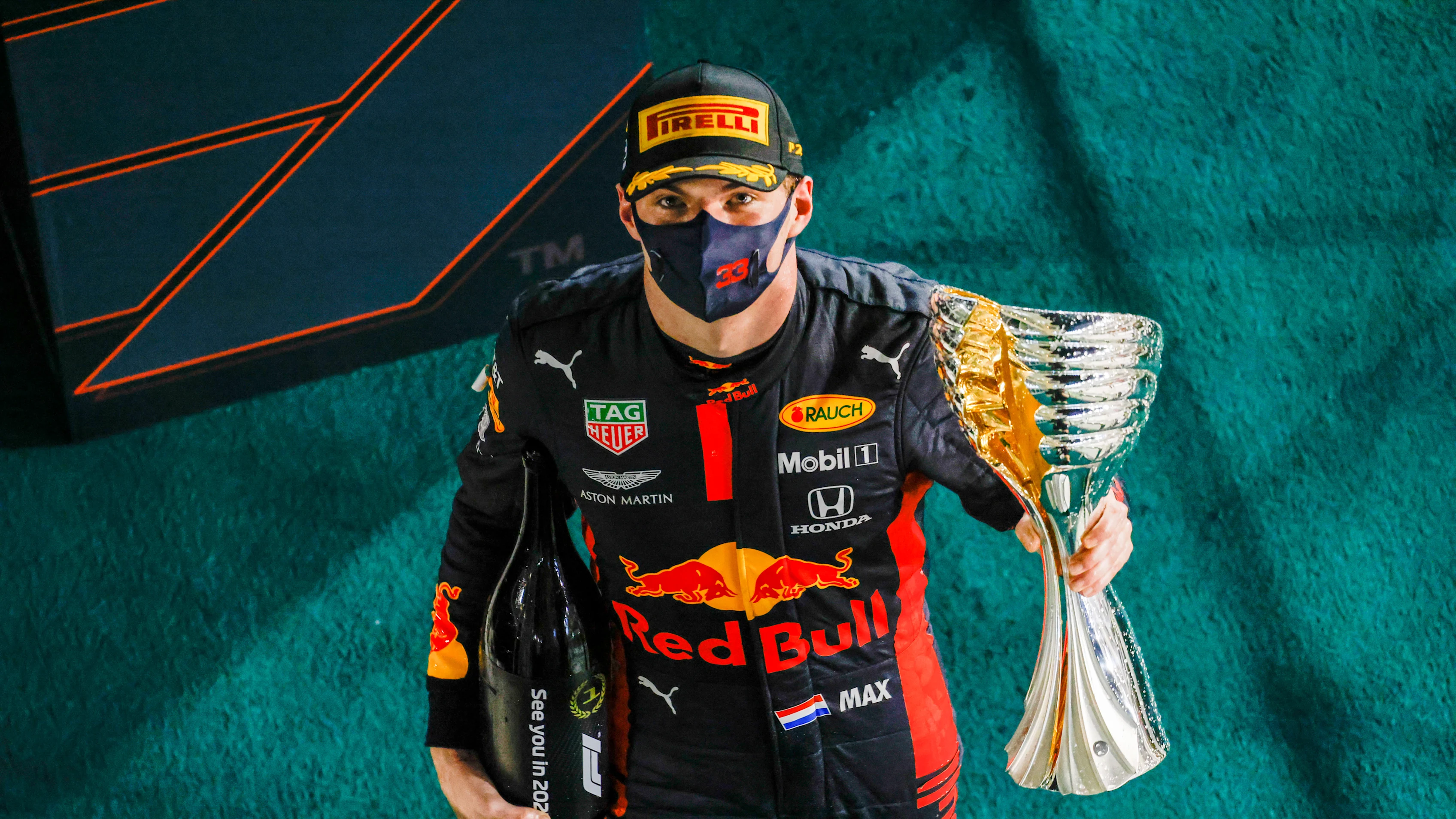 ABU DHABI, UNITED ARAB EMIRATES - DECEMBER 13: Race winner Max Verstappen of Netherlands and Red