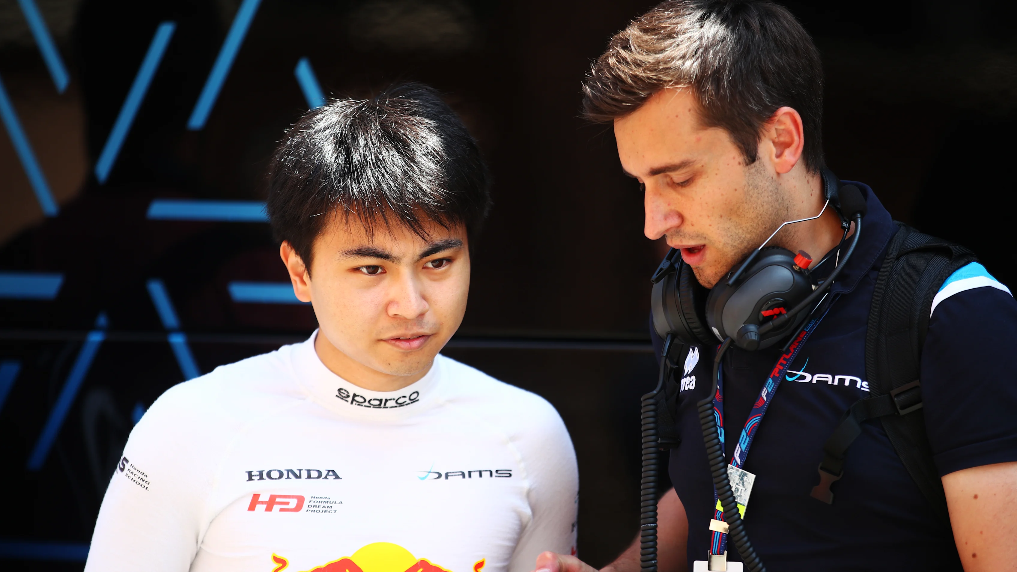 MONTE-CARLO, MONACO - MAY 25: Ayumu Iwasa of Japan and DAMS talks with a team member in the Paddock