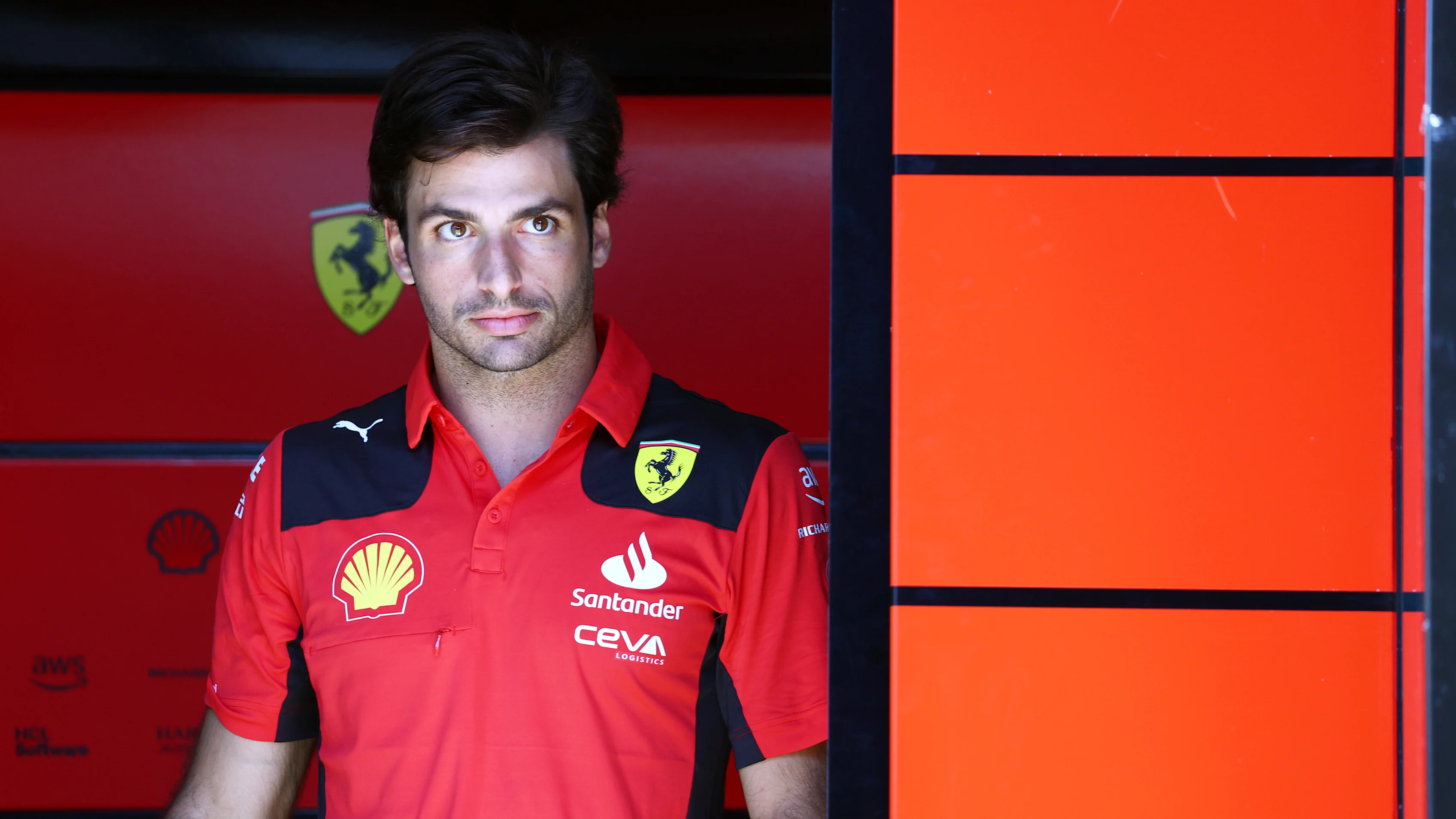 SPIELBERG, AUSTRIA - JUNE 29: Carlos Sainz of Spain and Ferrari looks on in the Paddock during