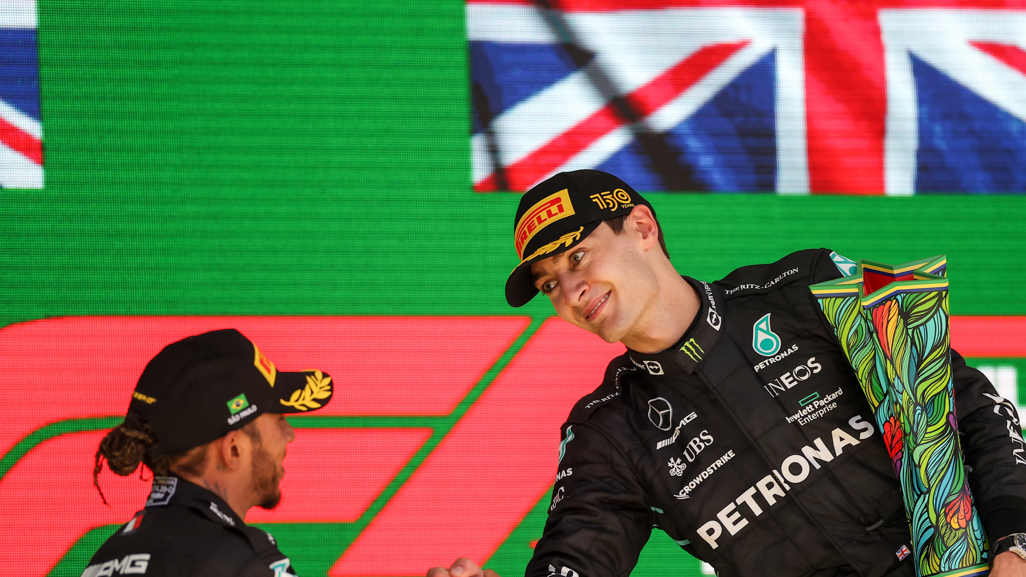 SAO PAULO, BRAZIL - NOVEMBER 13: Lewis Hamilton of Mercedes and Great Britain congratulates George